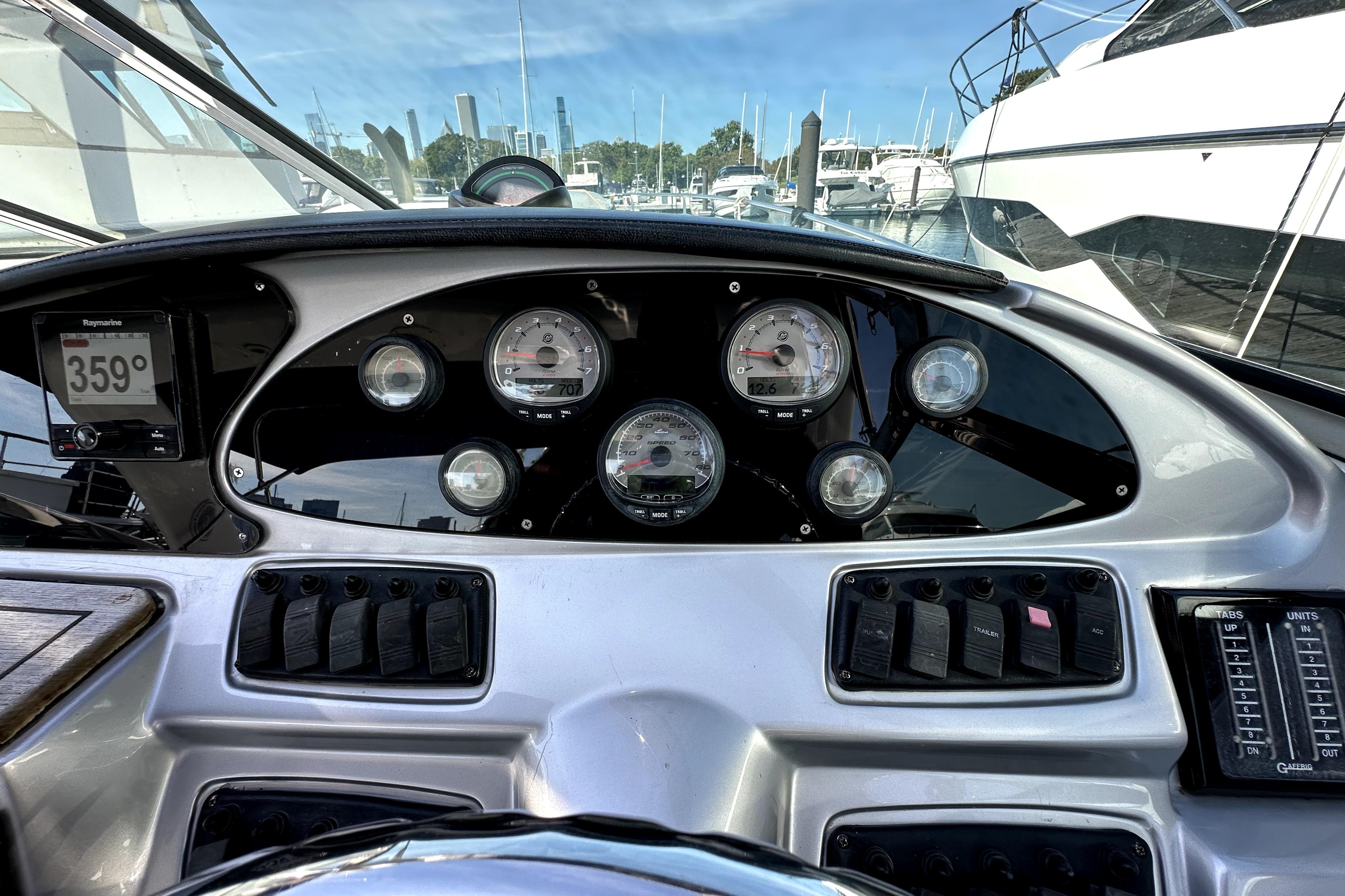 Dashboard of a 2003 Donzi 39 ZSC boat with gauges and controls.