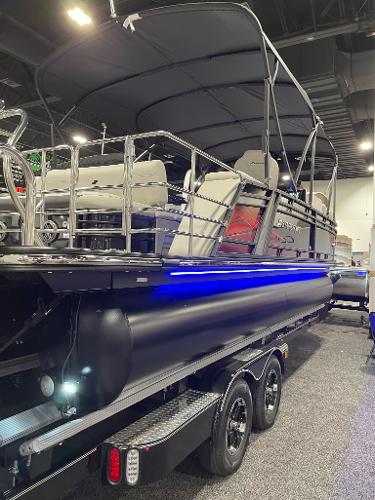 2022 Starcraft SLS-3Q DH pontoon boat with blue LED lights on trailer.