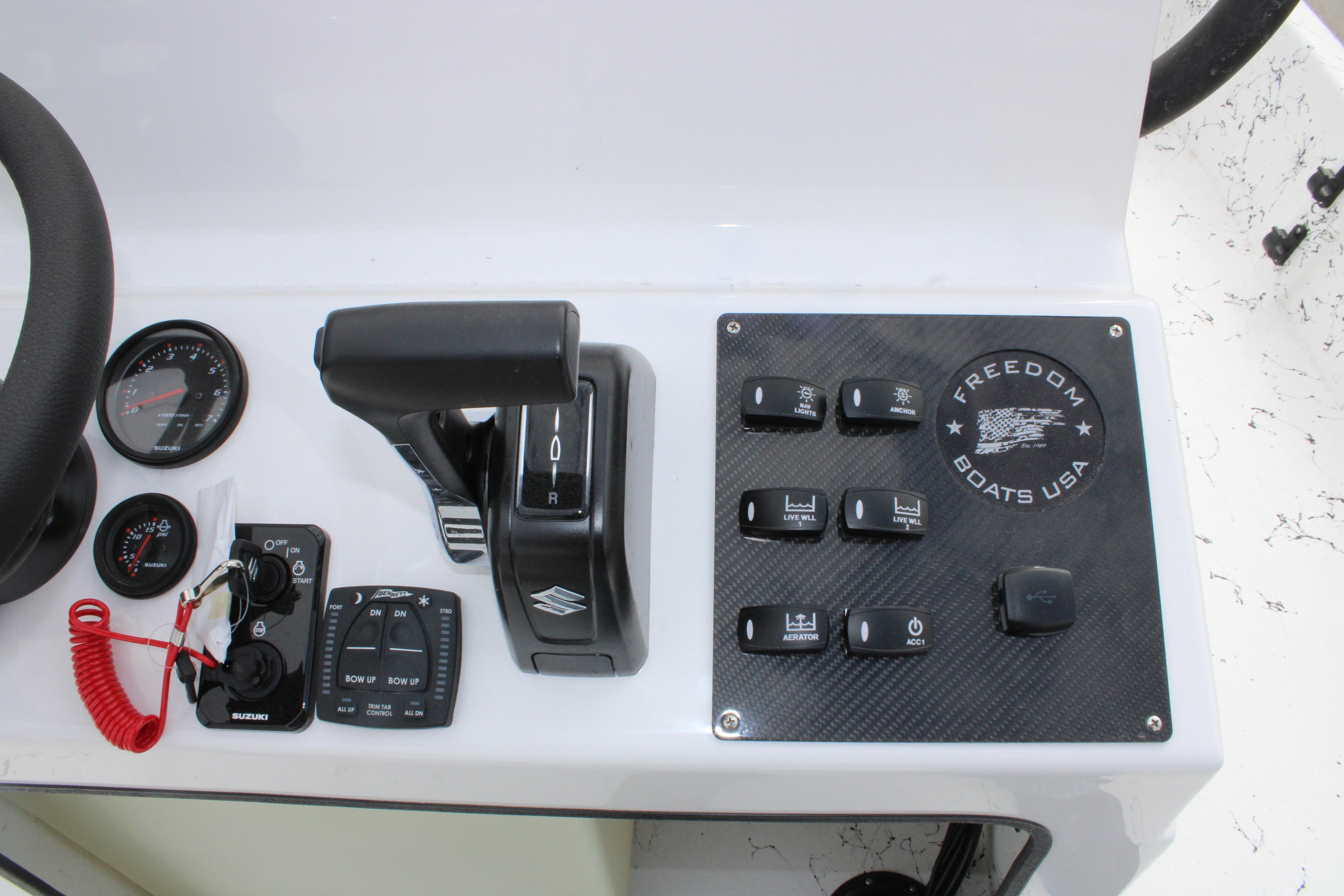 Control panel of 2026 Freedom Boats 19 PATRIOT with steering and switches.