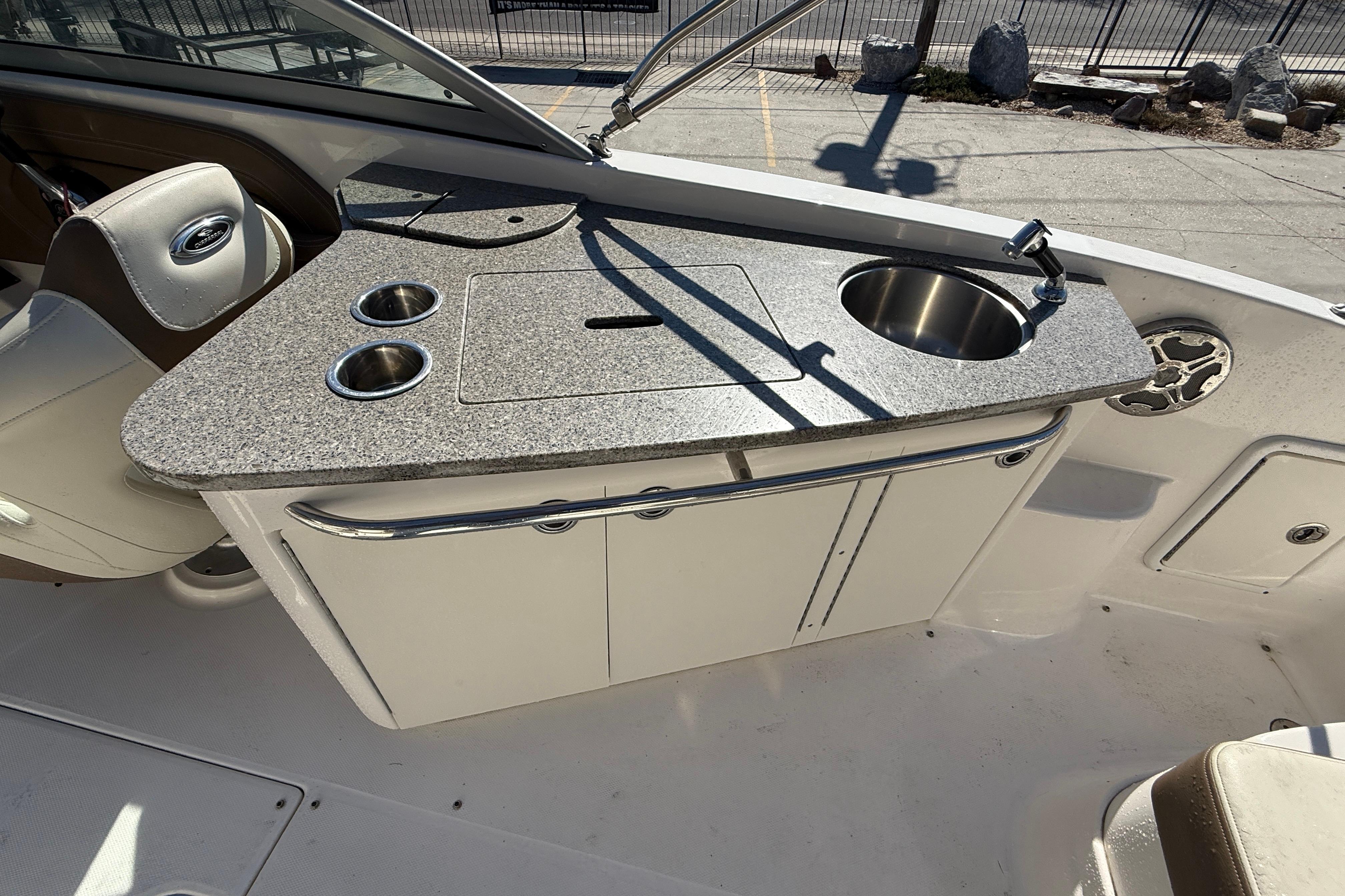 2014 Chaparral 264 Sunesta boat interior with kitchenette and sink.