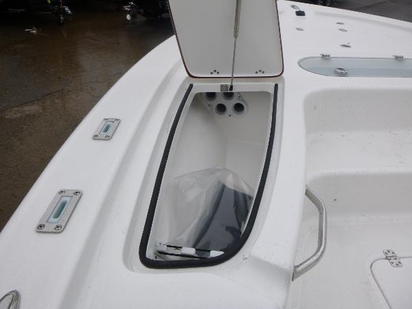 2025 Sea Pro 250 Bay boat storage compartment with open lid, showcasing interior details.