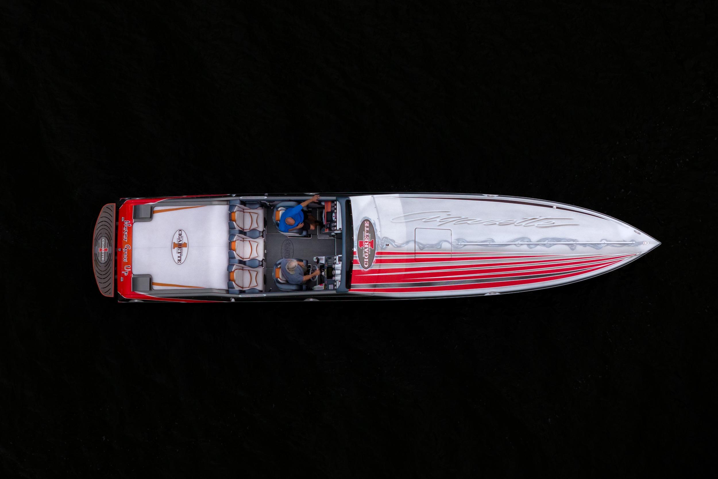 Overhead view of a 2006 Cigarette 39' Top Gun speedboat with red and white design.