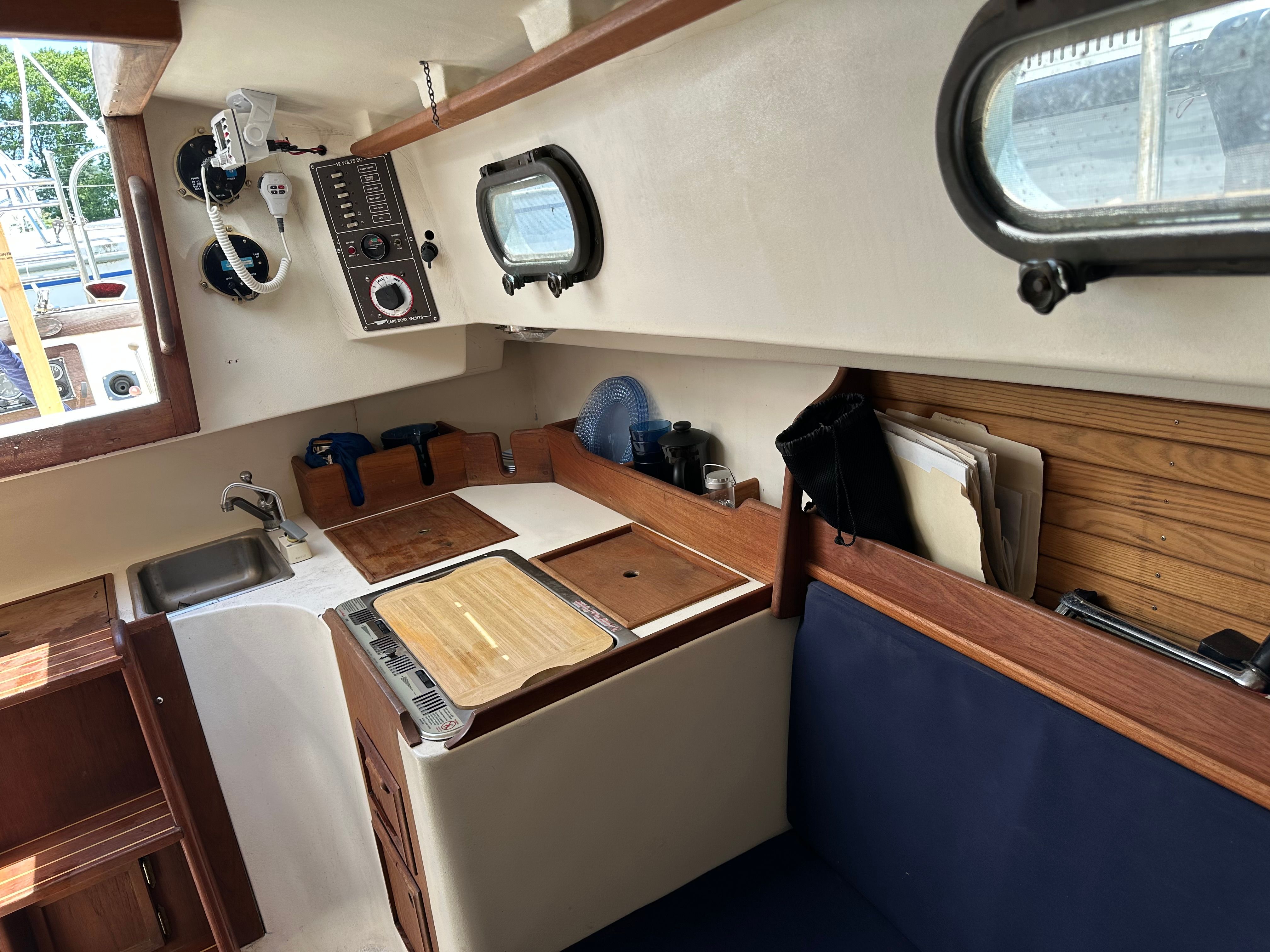 Interior of a 1985 Cape Dory 25D with a galley and seating area.