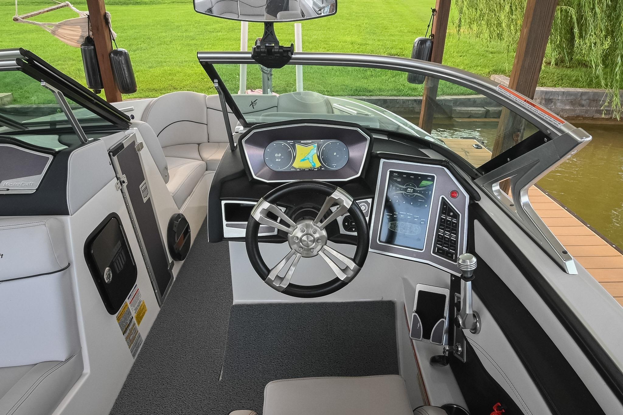 2018 MasterCraft X23 boat interior with modern dashboard and steering wheel.