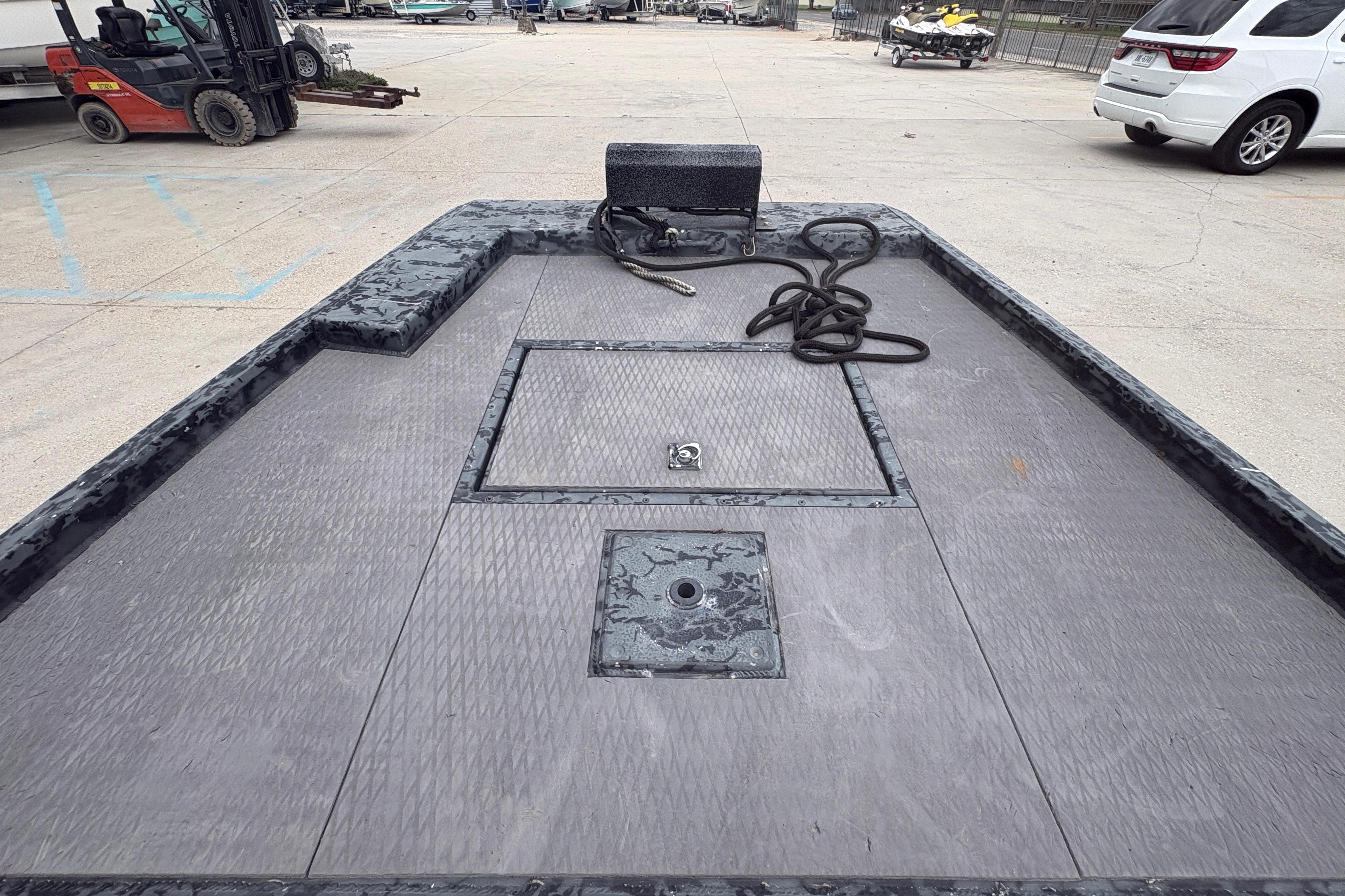 2020 Gator Tail Extreme boat deck with storage compartments and coiled rope.