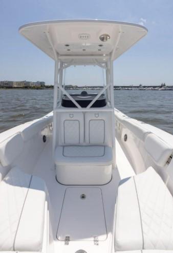 2026 Sea Fox 228 Commander boat on water, featuring spacious deck and modern design.