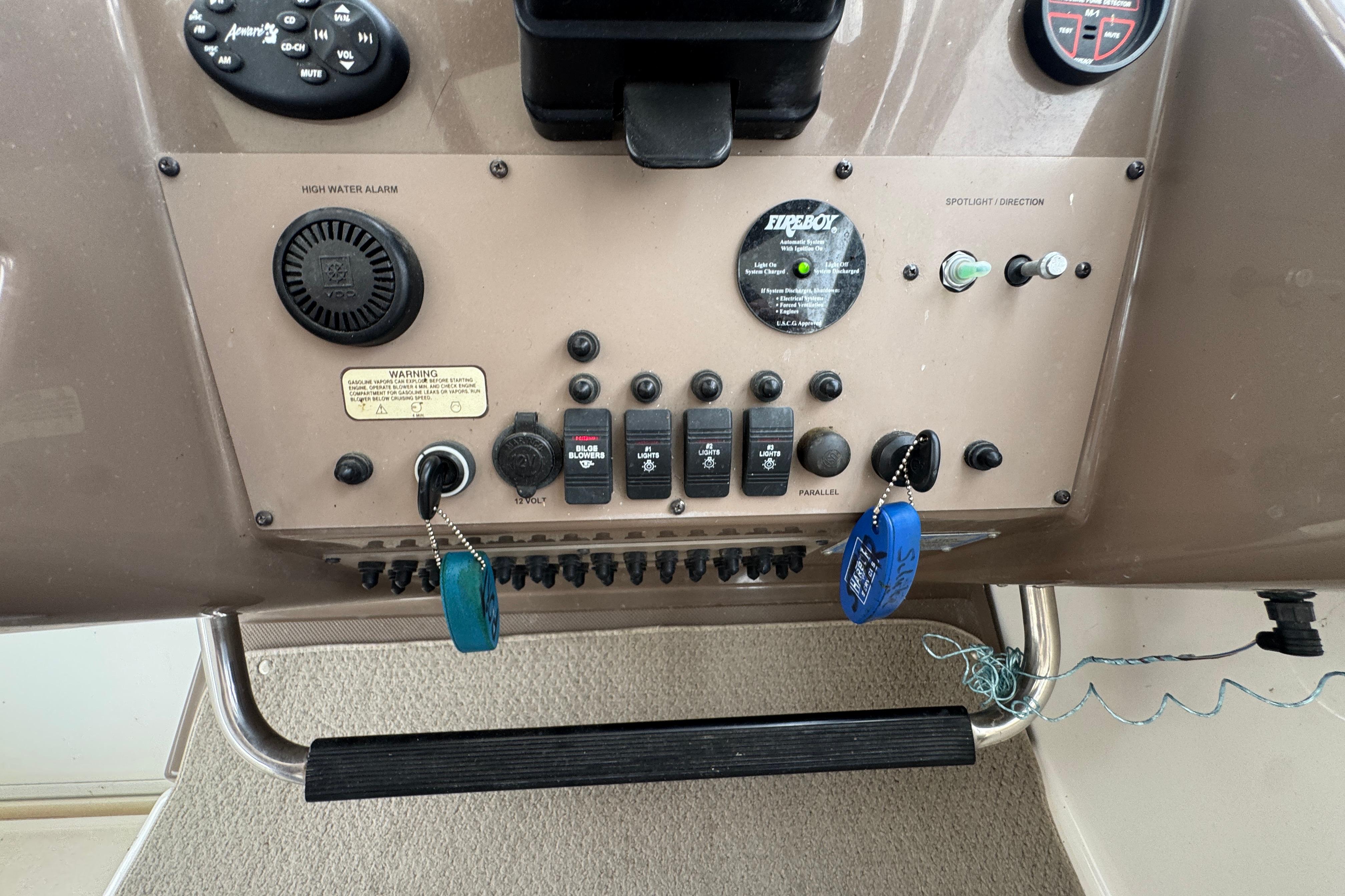 Control panel of a 2005 Regal Commodore 4260 boat with switches and keys.