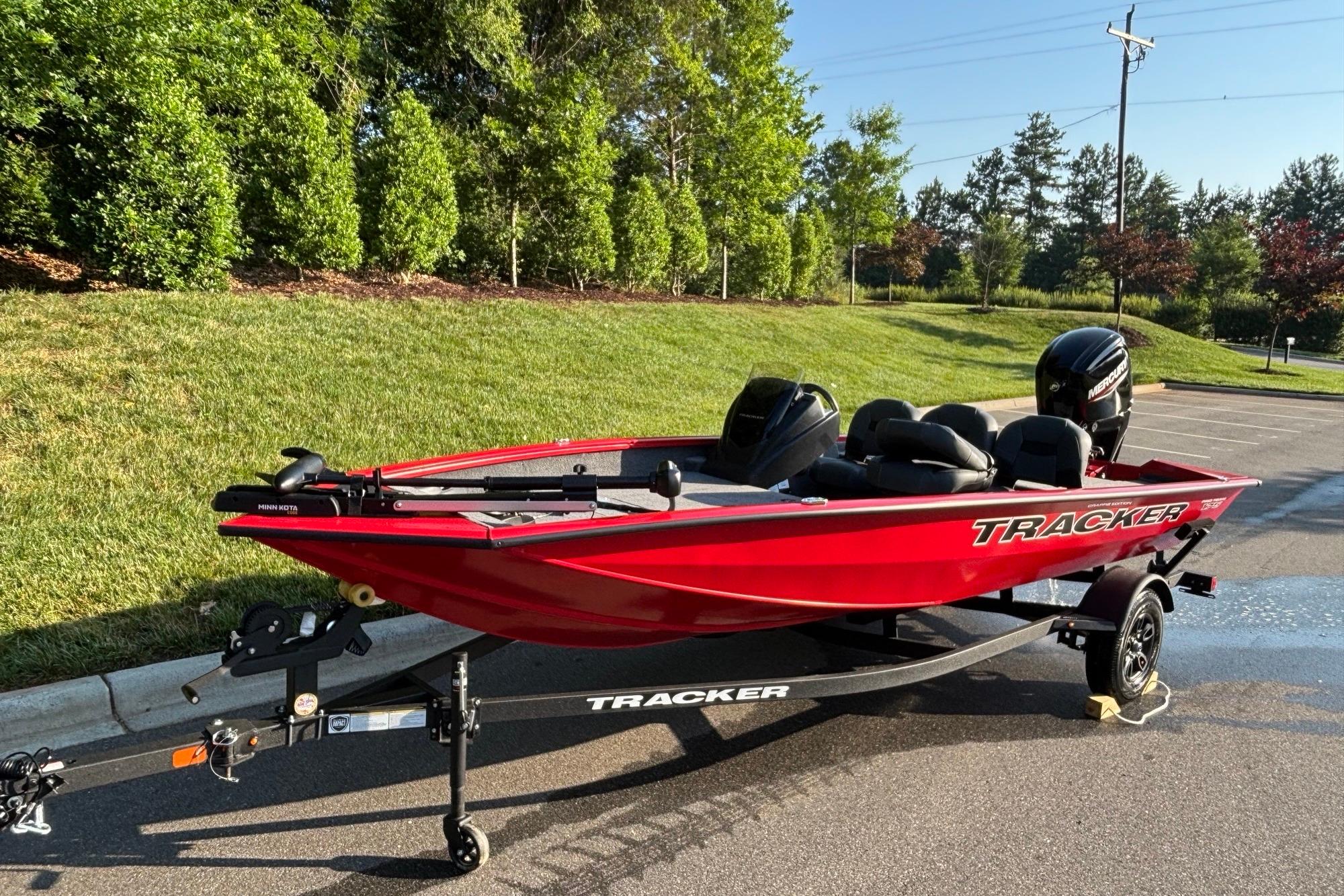 2026 Tracker Pro Team 175 Crappie Edition boat on trailer, parked outdoors.