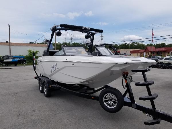 2023 ATX Surf Boats 20 Type-S on trailer in parking lot.