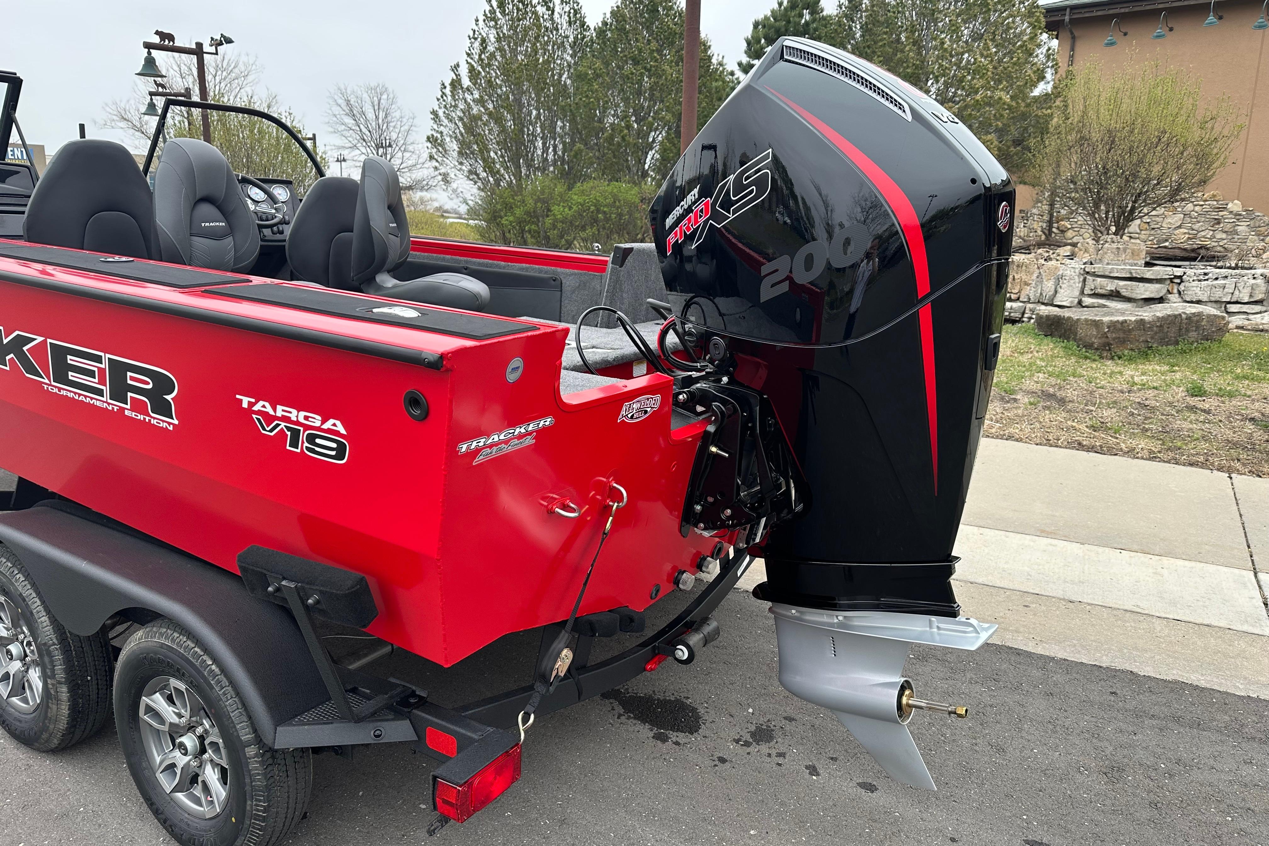 Red 2026 Tracker Targa V-19 Combo boat with powerful outboard motor.