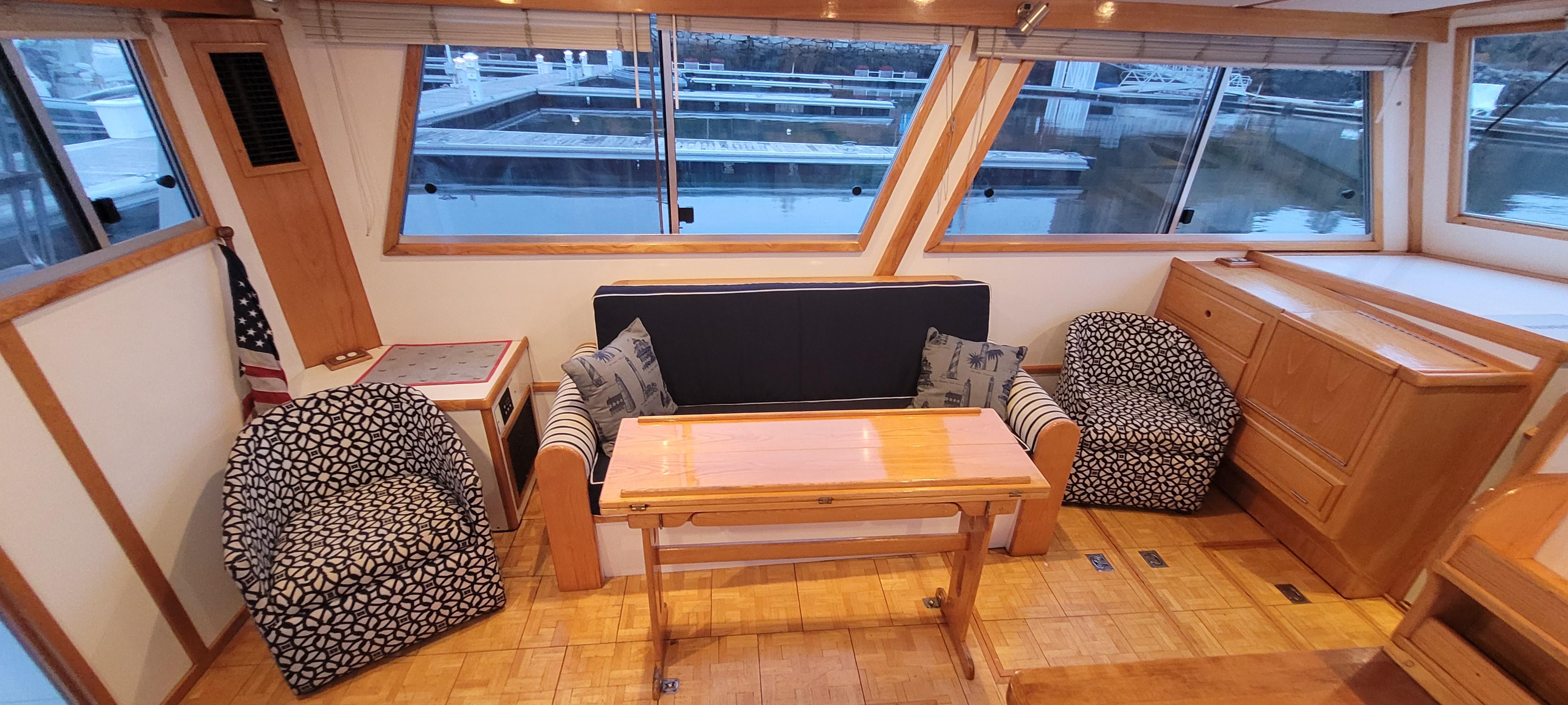 Interior of 1989 Duffy Wilbur 42 Flybridge Cruiser with seating and table.
