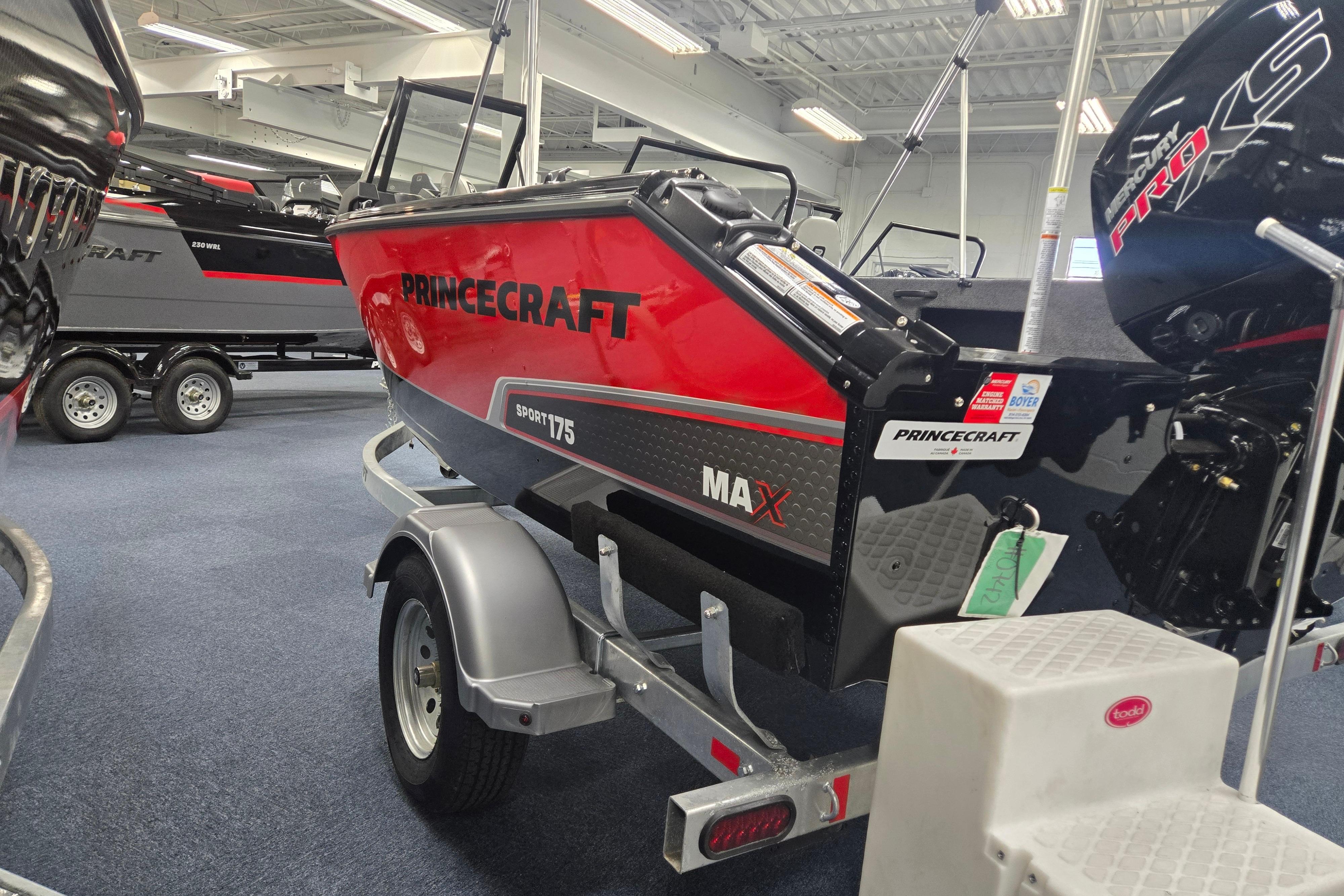 2026 Princecraft Sport 175 MAX boat on display in showroom, featuring sleek red design.