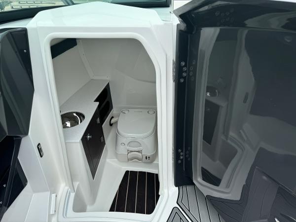 2018 Monterey 258 Super Sport boat interior with compact bathroom and sink.