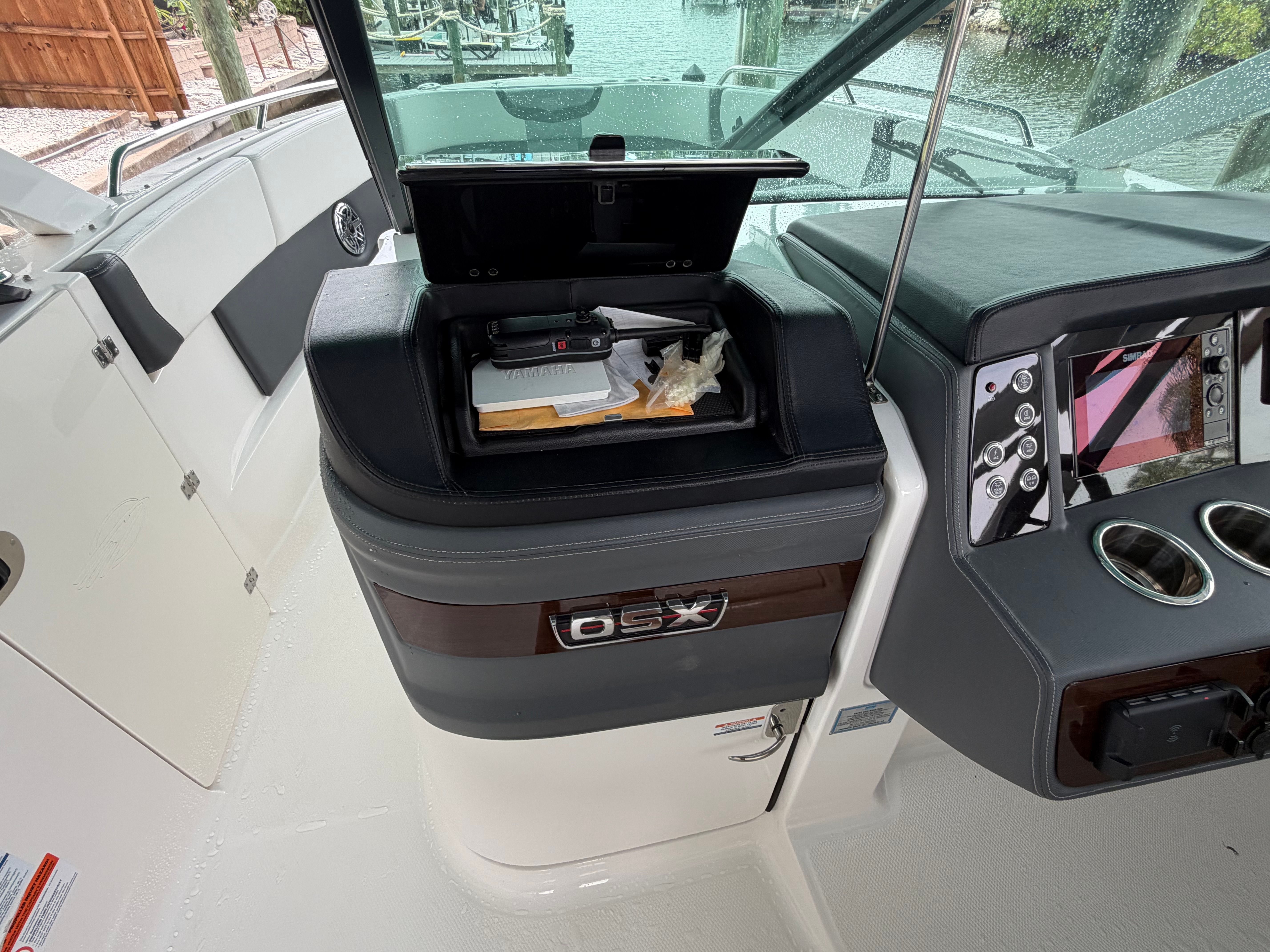 The cockpit of a Chaparral 280 OSX with controls and storage.