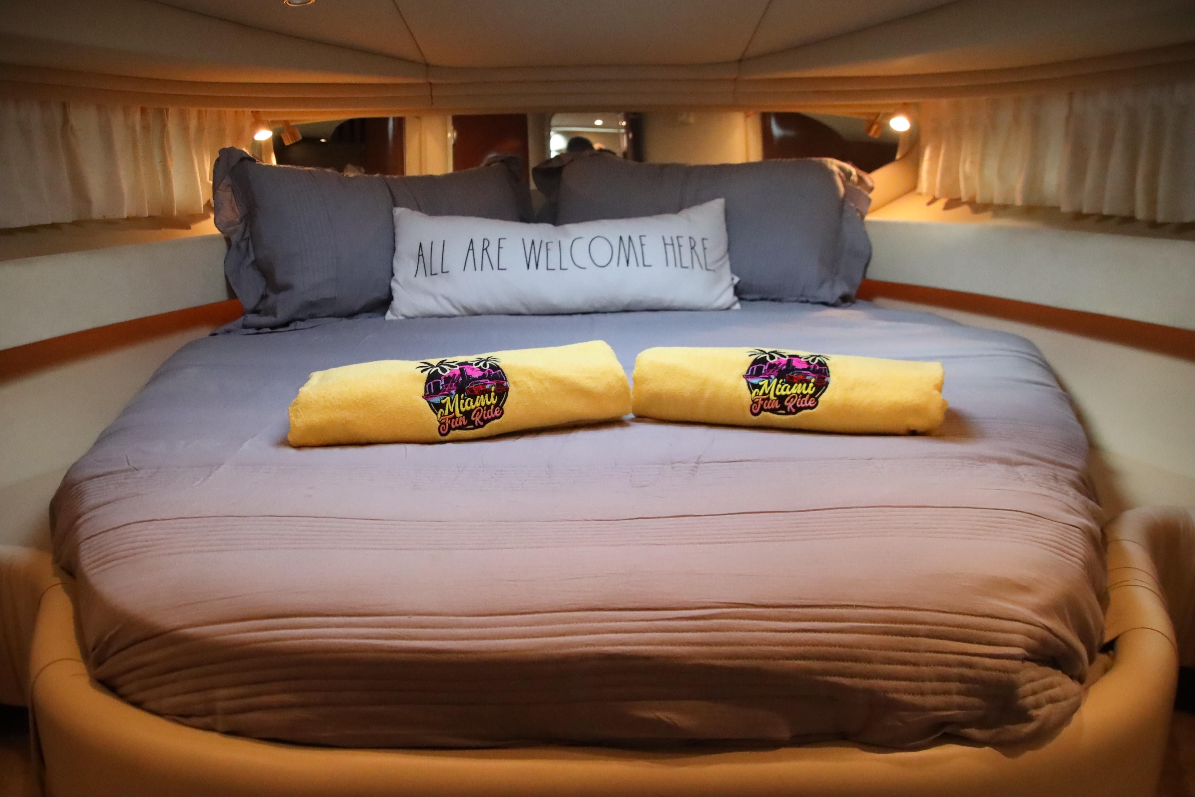 Cabin of the 2002 Sea Ray 410 Express Cruiser with a cozy bed.
