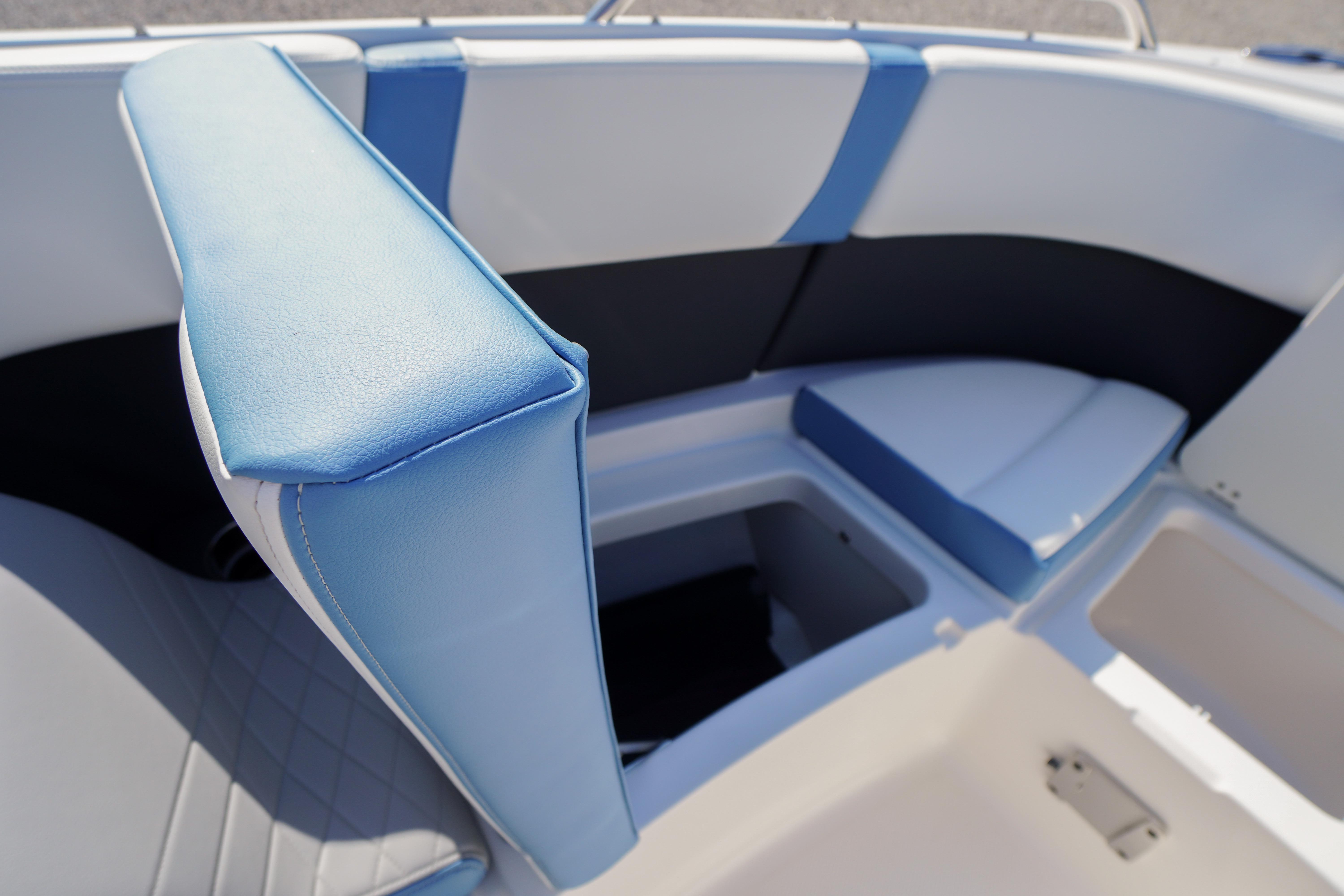 Interior seating of 2026 Chaparral 270 OSX boat with blue and white upholstery.