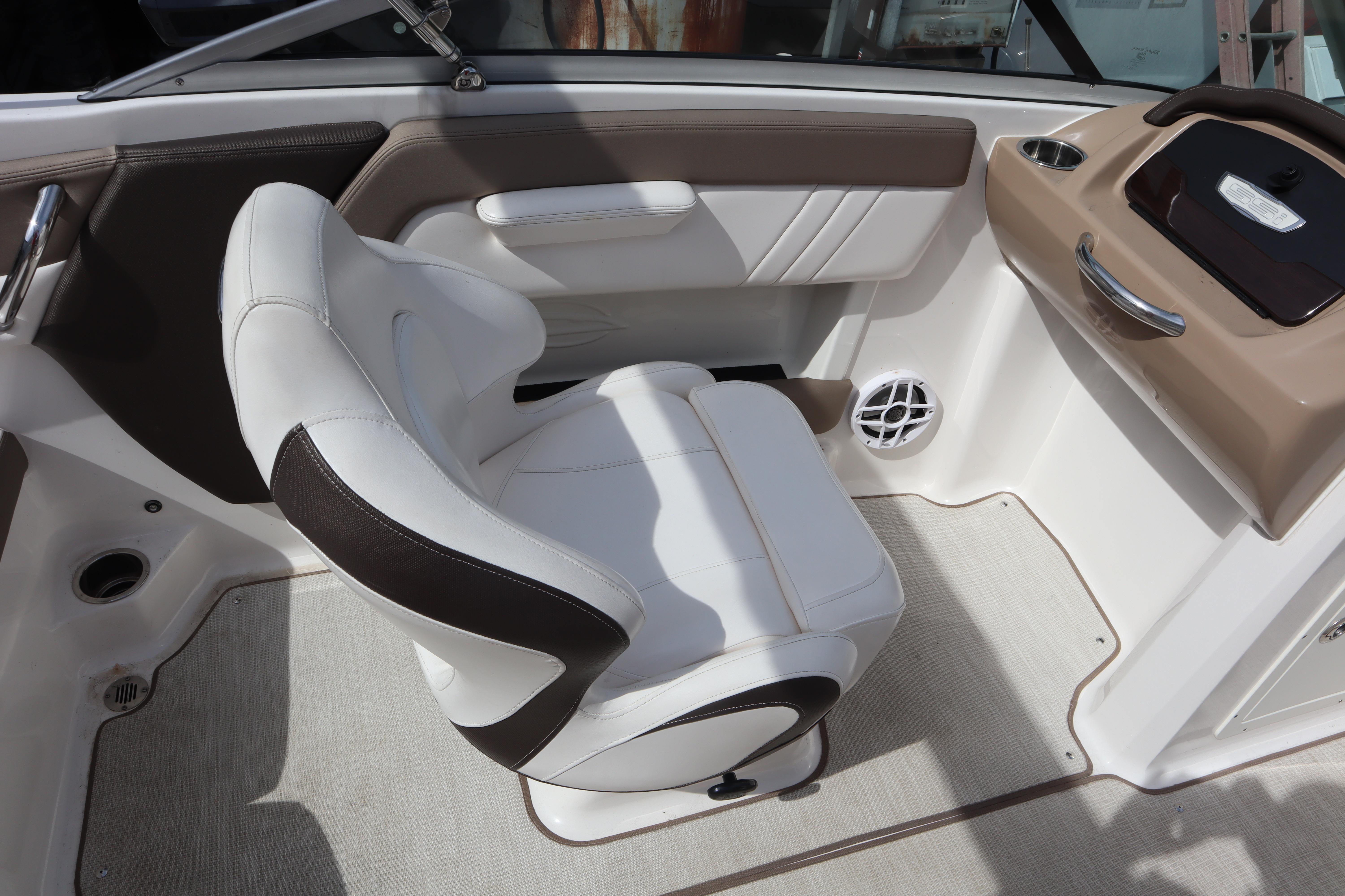 2021 Chaparral 21 SSi boat interior with white and brown seating.