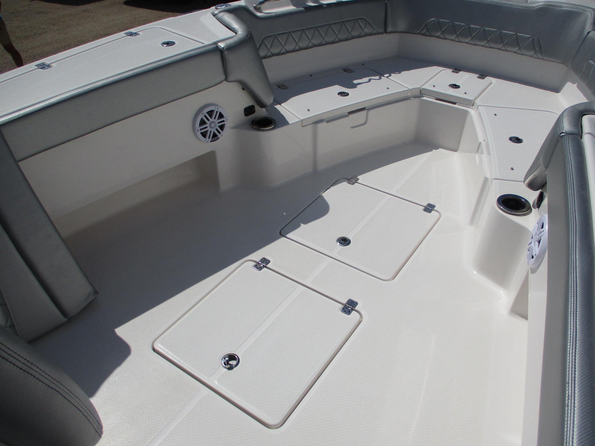 2024 Blue Wave 2800 Makaira boat interior with storage compartments and seating.