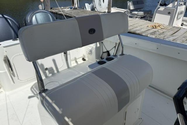 2006 Sailfish 2660 CC boat interior with cushioned seating and cup holders.