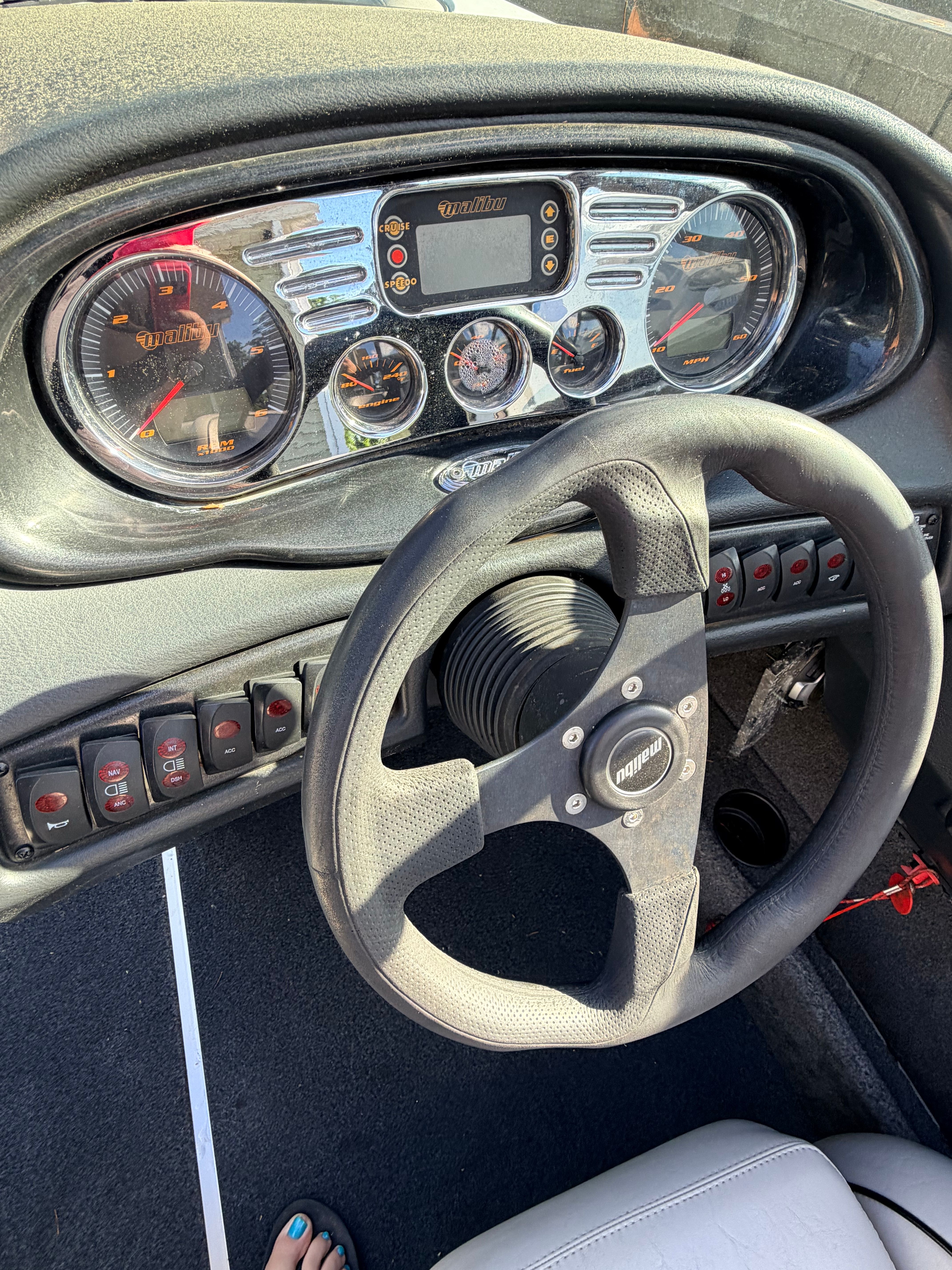 Dashboard of a 2006 Malibu iRide with steering wheel and gauges.
