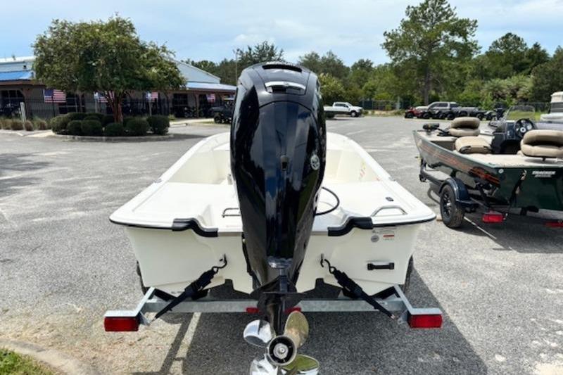 2026 Mako Pro Skiff 17 CC boat on trailer, parked outdoors.