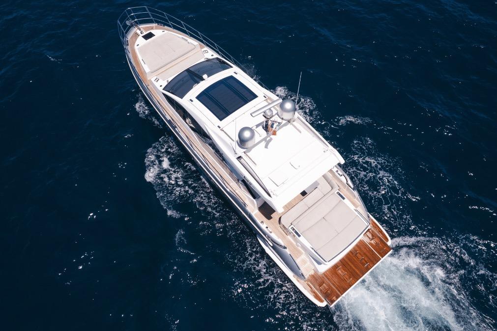 Aerial view of 2020 Azimut 60 yacht cruising on open sea.