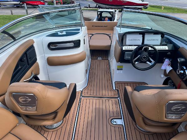 2024 Crownline Eclipse E255 boat interior with tan seating and Garmin navigation system.