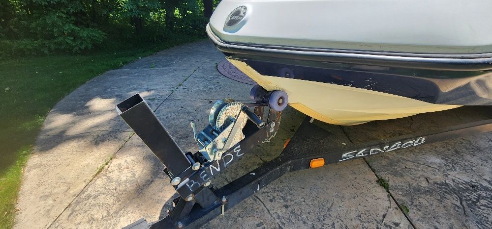A 2007 Sea-Doo Sport Boat 230 Challenger SE on a trailer.