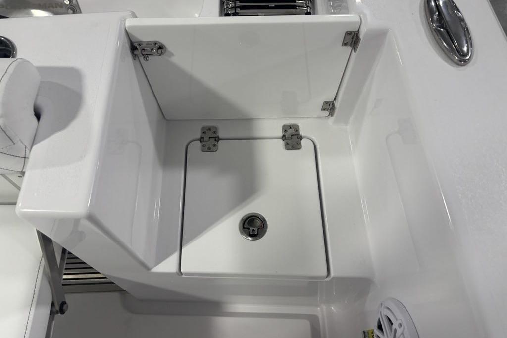 Open storage compartment on 2026 Sportsman Open 252 Center Console boat.