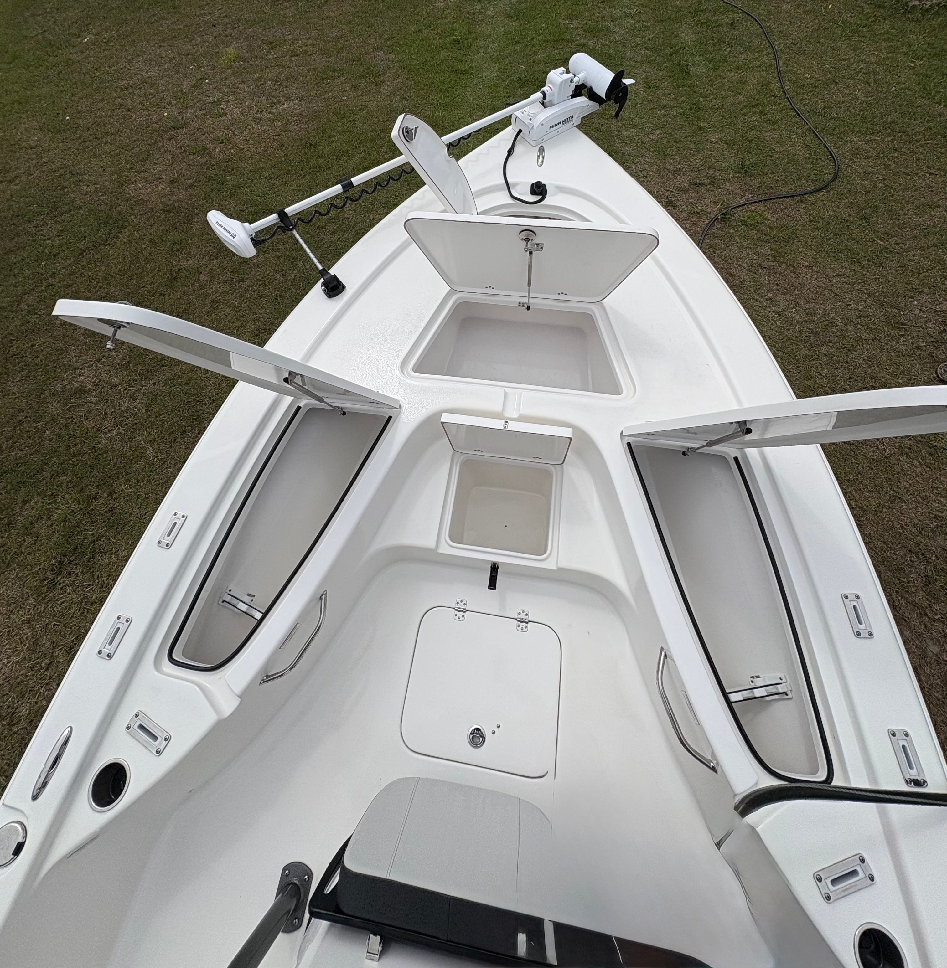 Interior view of 2025 Sea Pro 230 Bay boat with storage compartments.