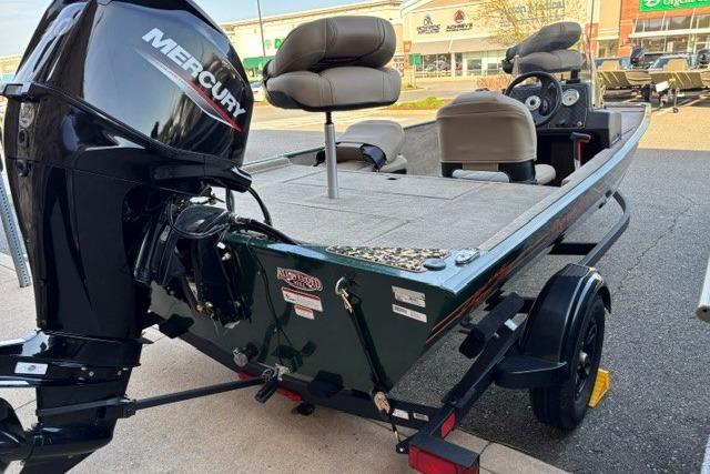 2026 Tracker Bass Tracker Classic Limited boat with Mercury engine, parked on a trailer.