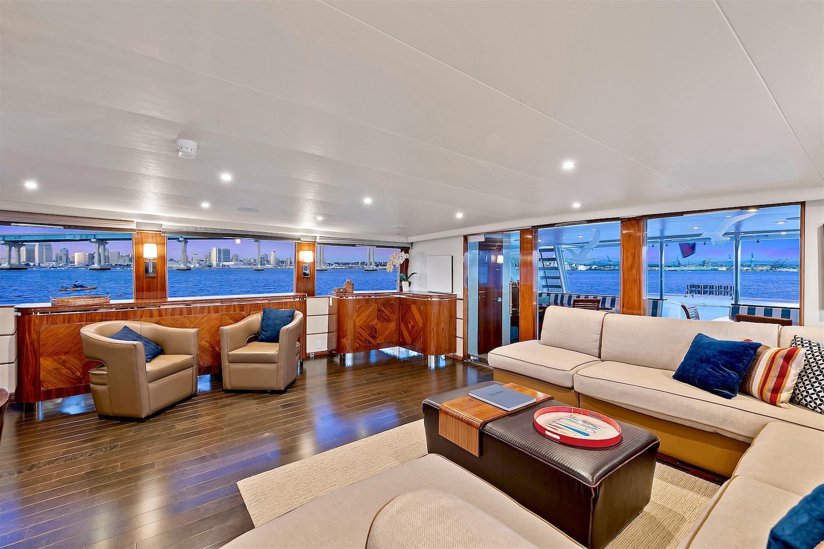 Luxurious 1987 Deep Sea Marine motor yacht interior with elegant seating and panoramic ocean views.