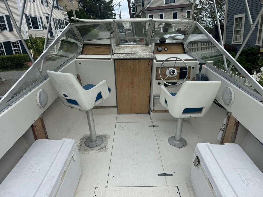 Interior view of a 1973 SeaCraft TSUNAMI boat with helm.