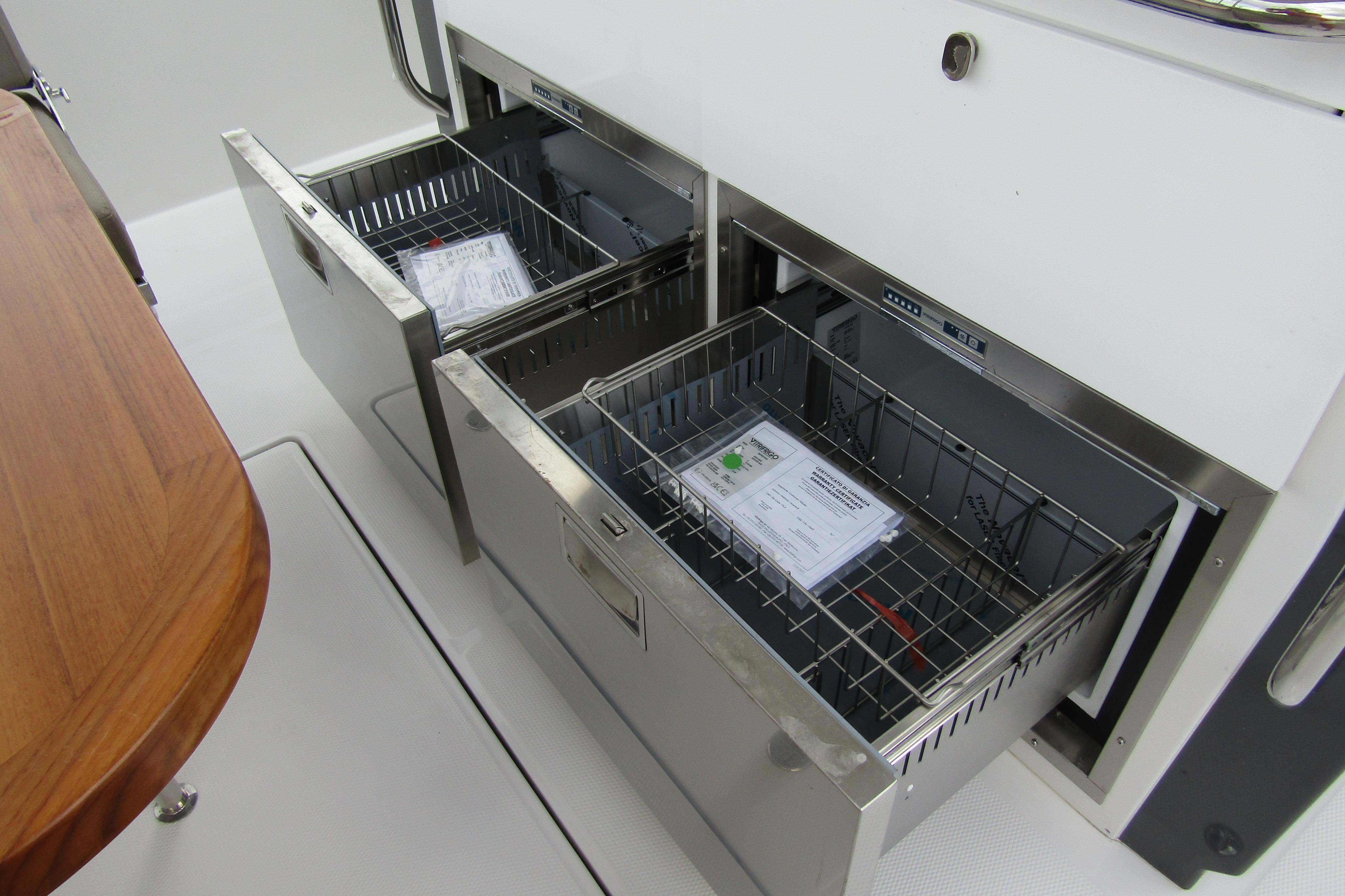 Stainless steel storage drawers on 2025 Nimbus Tender 11 boat interior.