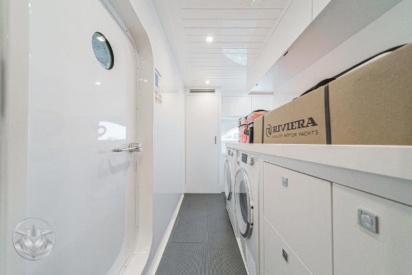 Laundry room inside the 2025 Riviera 645 SUV luxury motor yacht.