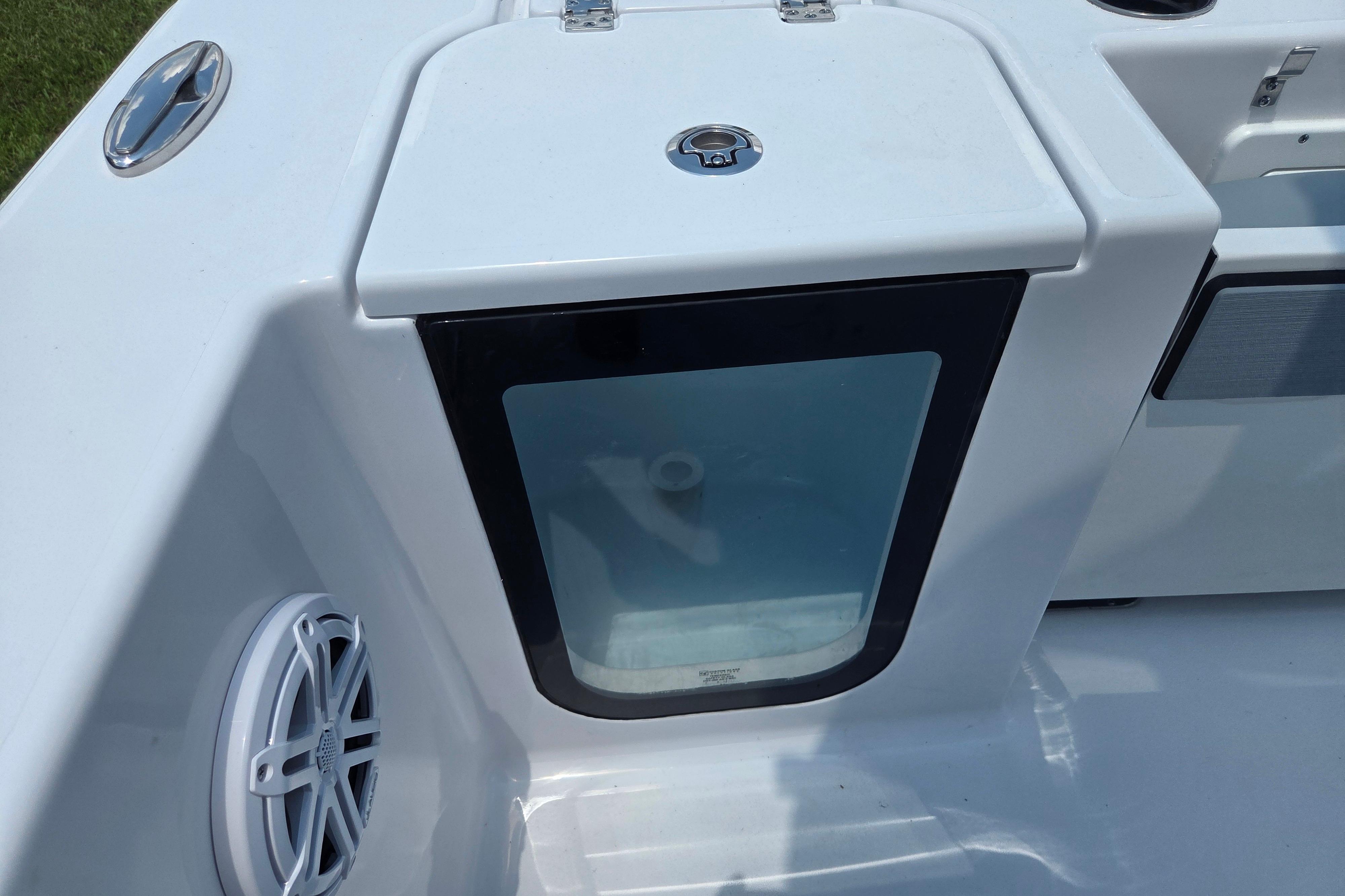 2026 Sportsman Open 212 Center Console boat detail with speaker and storage compartment.