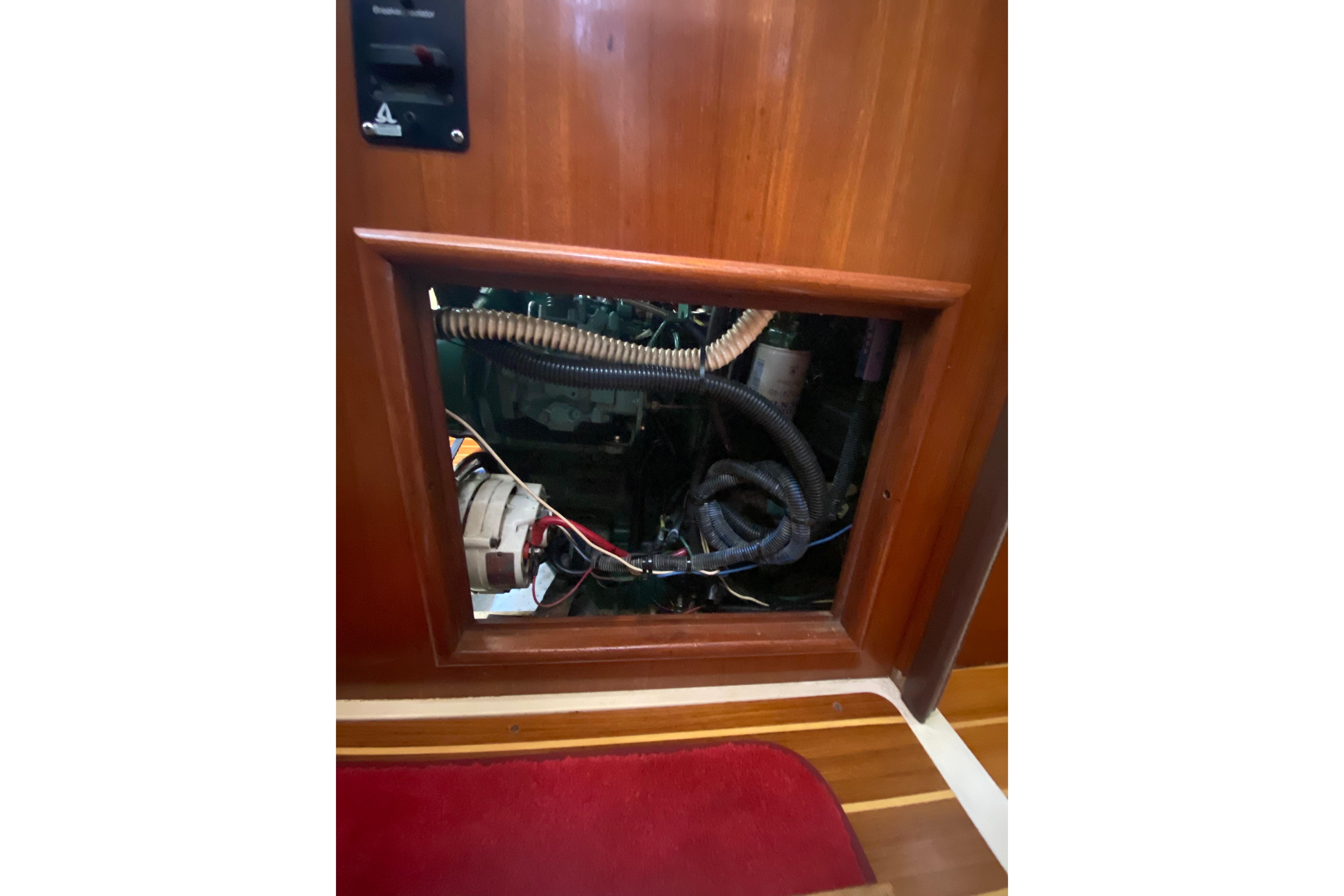 Engine compartment of a 1997 Hunter Legend 40.5 sailboat, showcasing wiring and components.