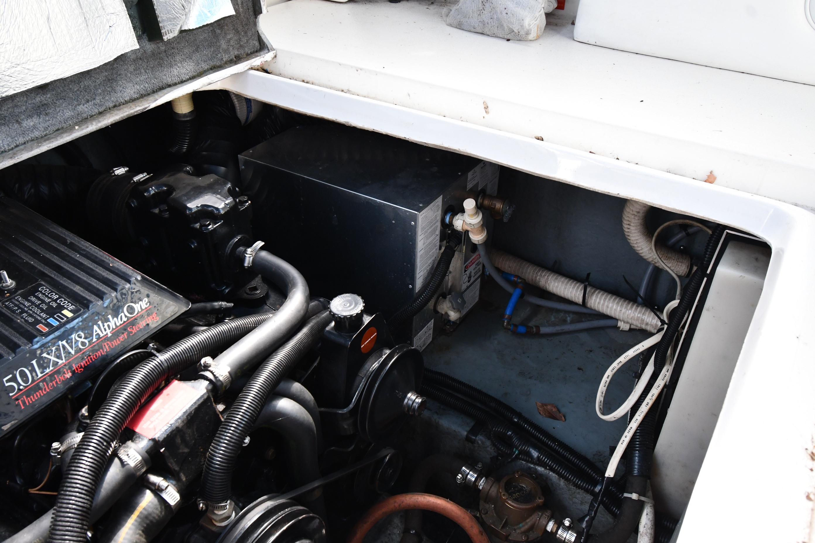 Engine compartment of a 1993 Sea Ray 300 Sundancer boat, showcasing mechanical components.