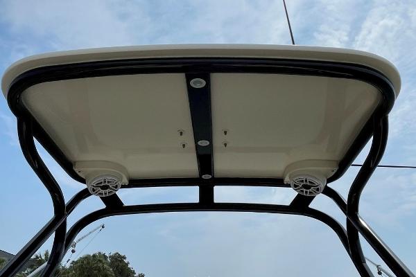 T-top view of 2020 Scout 420 LXF boat with speakers and sky background.