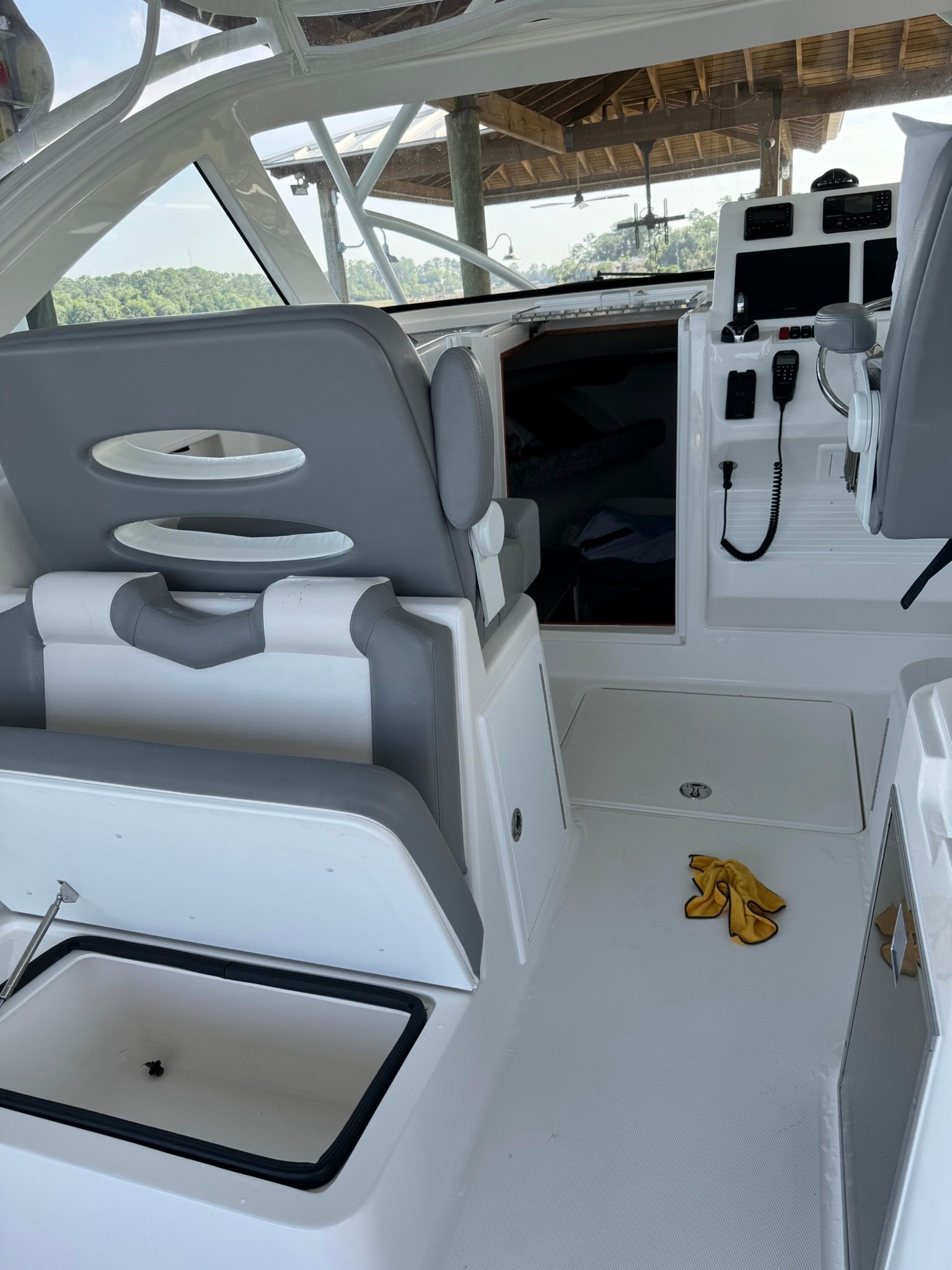 The image shows the cockpit of a 2024 Albemarle 30 Express boat with gray seating.