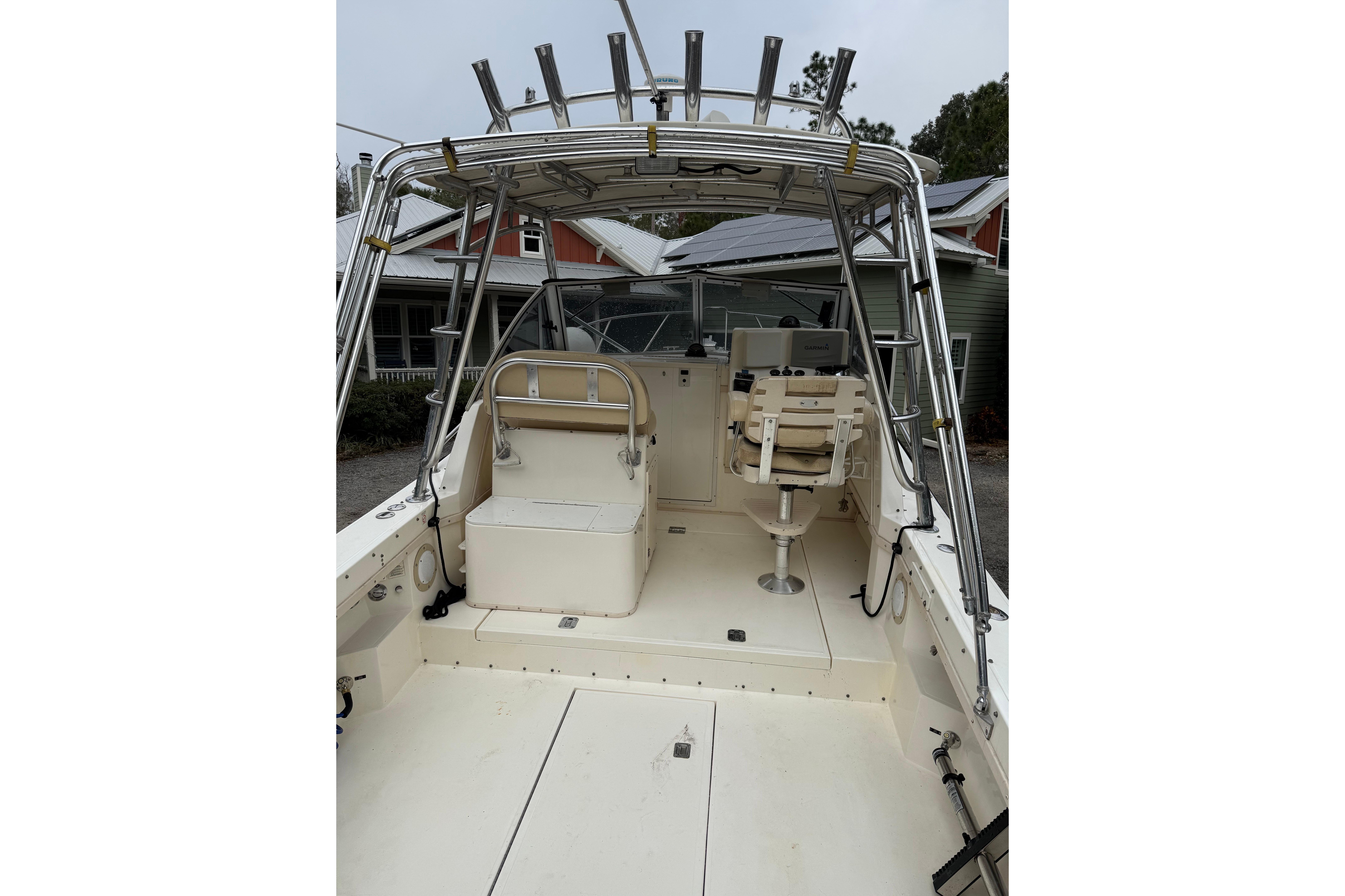 2002 Albemarle 265 Express Fisherman boat interior with seating and fishing rod holders.