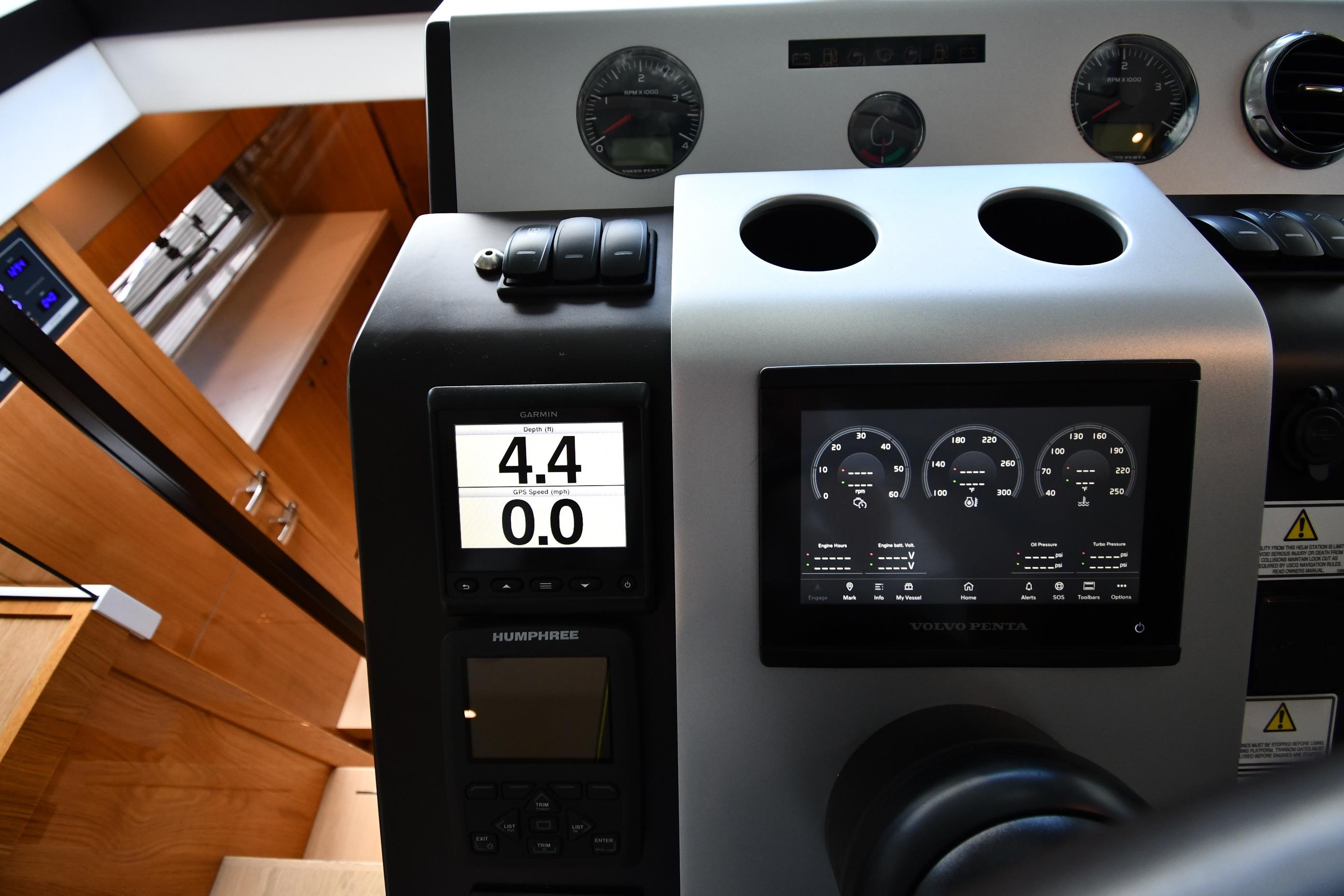 Dashboard of 2024 Fairline G50 Targa yacht with digital displays and controls.