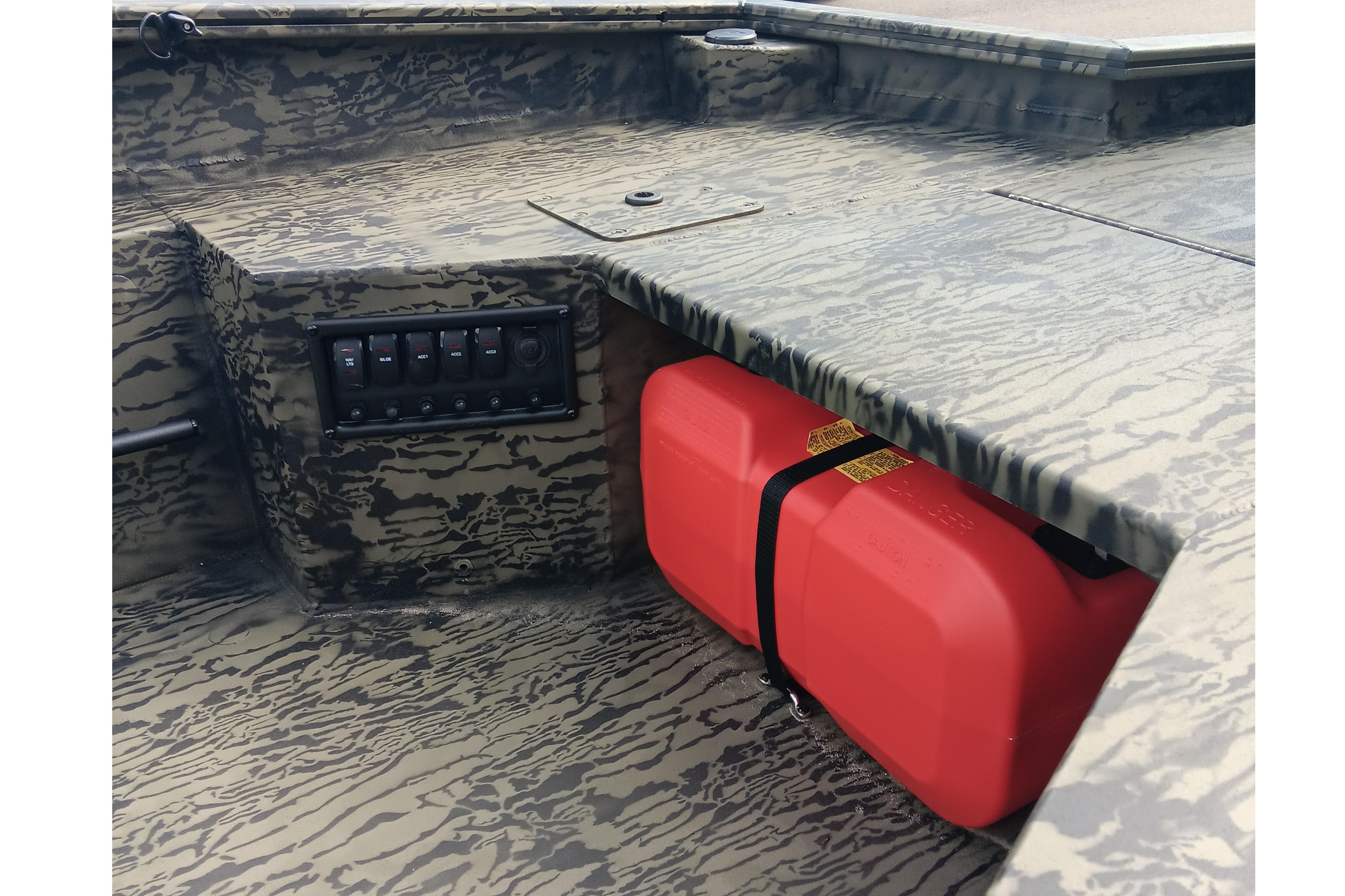 2026 Tracker Grizzly 1650 T Prairie Wings Edition boat interior with camo design and red fuel tank.