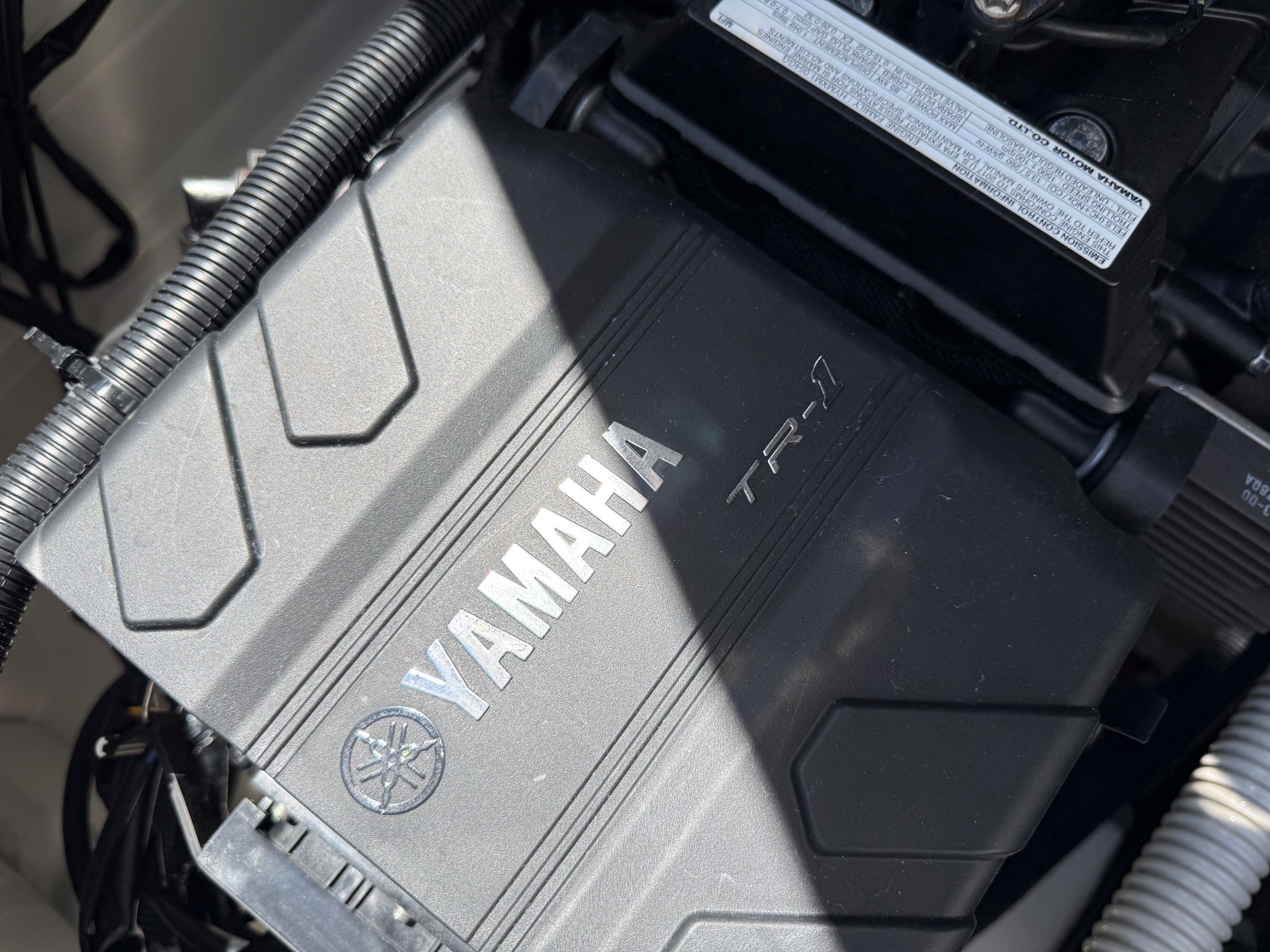 Close-up of a Yamaha TR-1 engine in a boat.