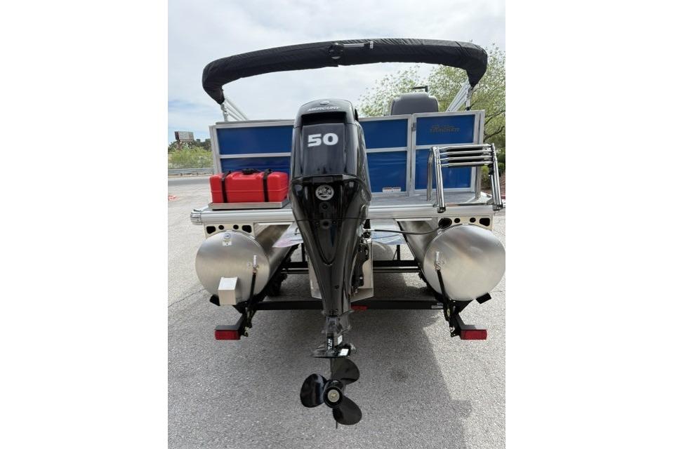 2026 Sun Tracker Party Barge 16 DLX pontoon boat with 50 HP outboard motor.