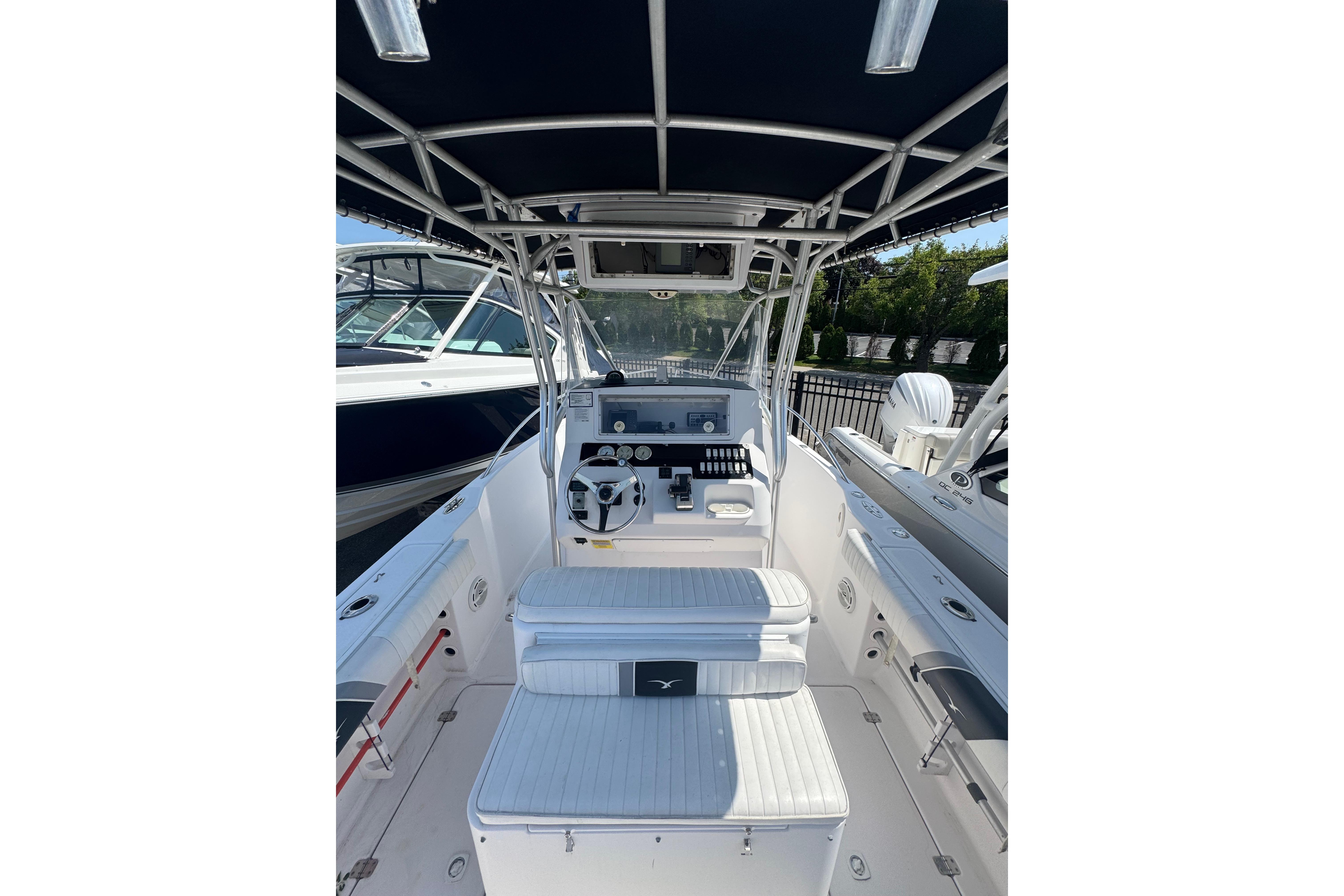 2002 Pro-Line 23 Sport boat interior with steering console and seating.
