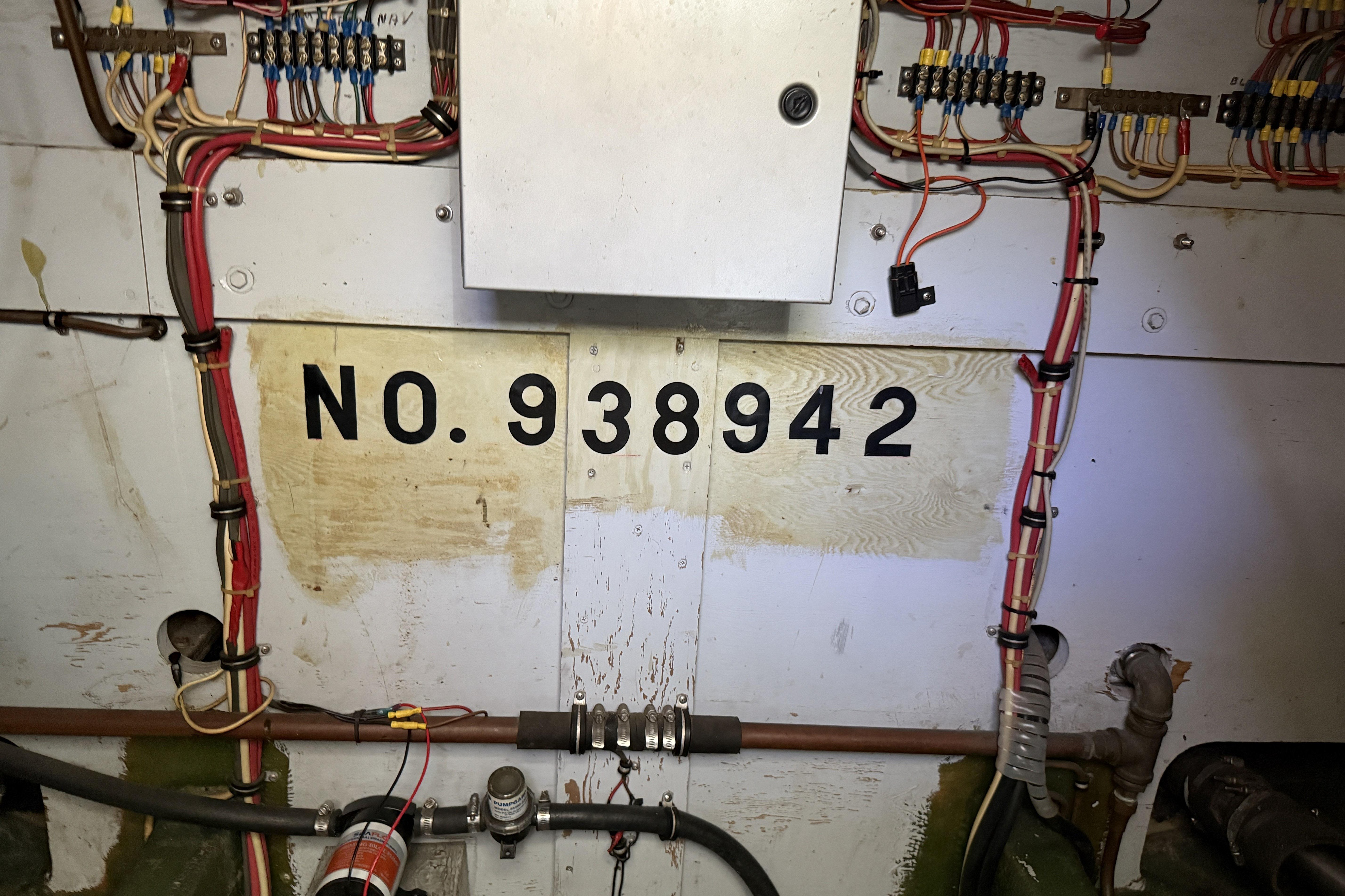 Engine room wiring of 1978 Bertram 42 Convertible, showing serial number 938942.