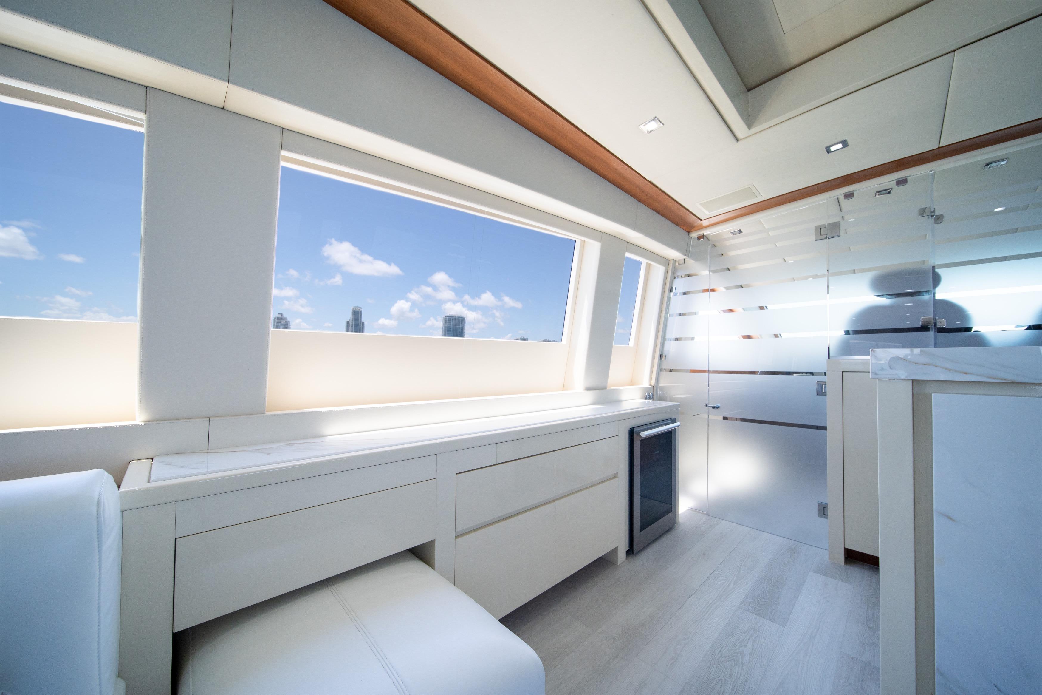Luxurious interior of 2008 Arno Leopard 31 yacht with modern design and panoramic windows.