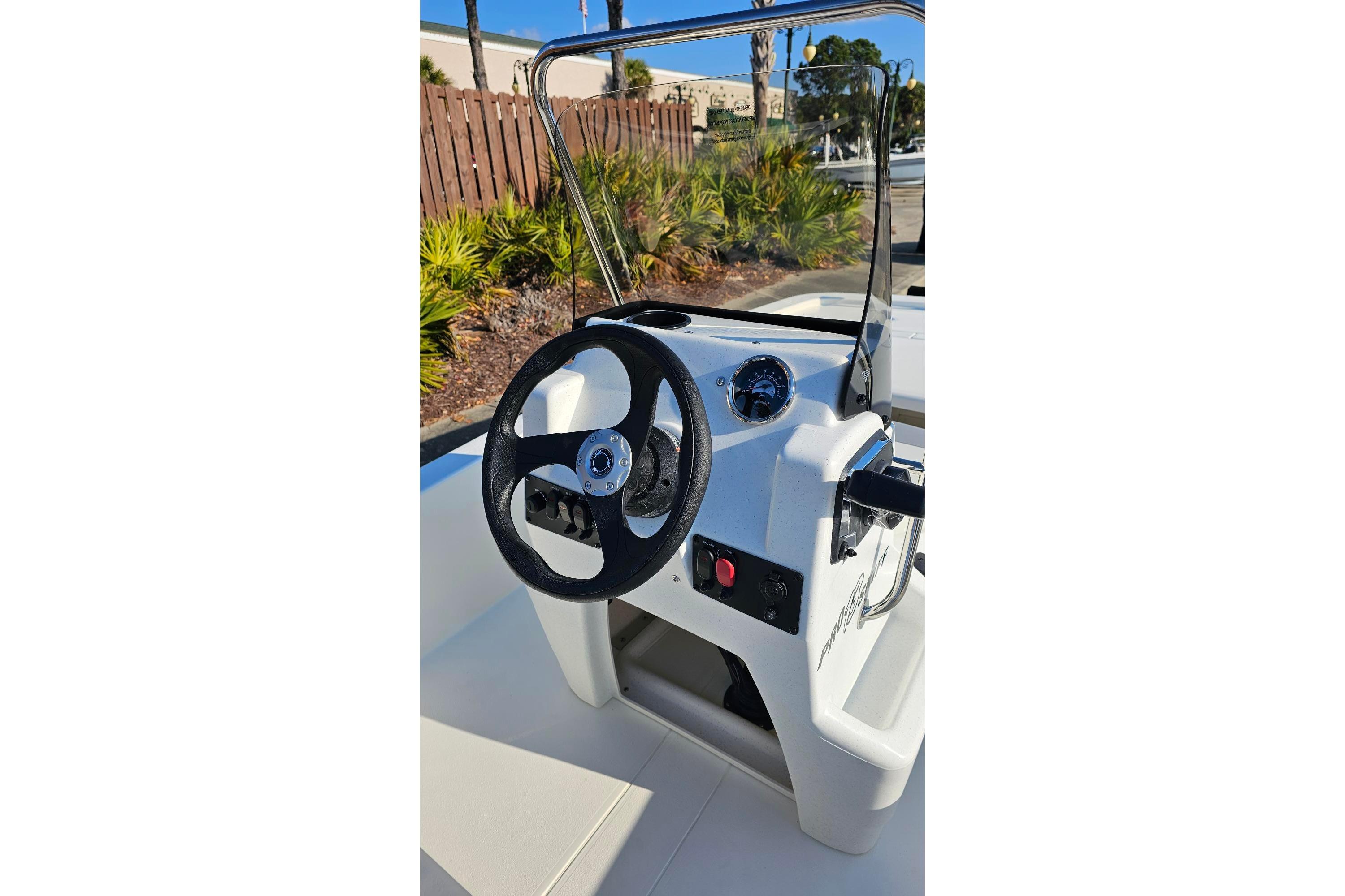 2026 Mako Pro Skiff 13 CC boat console with steering wheel and controls.