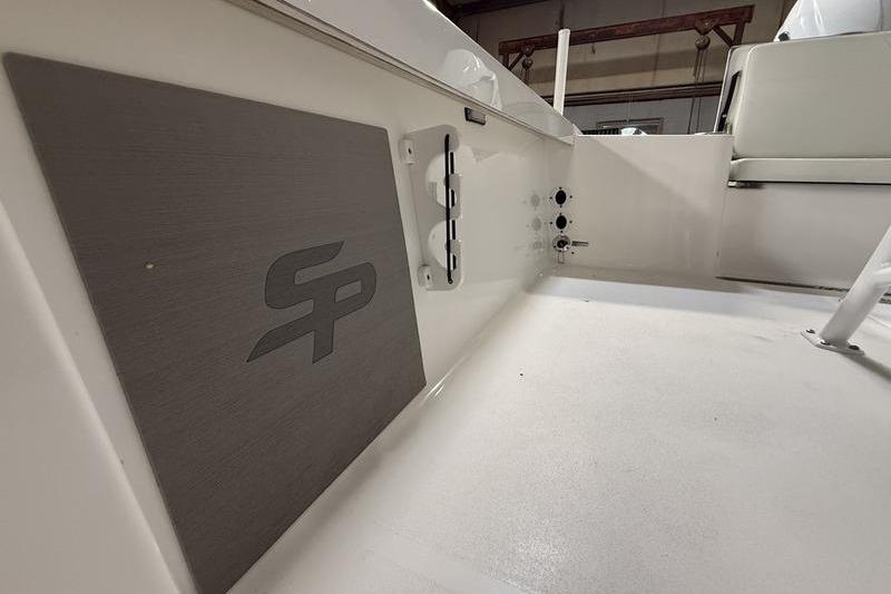 2026 Sea Pro 250 Bay boat interior with logo and seating detail.